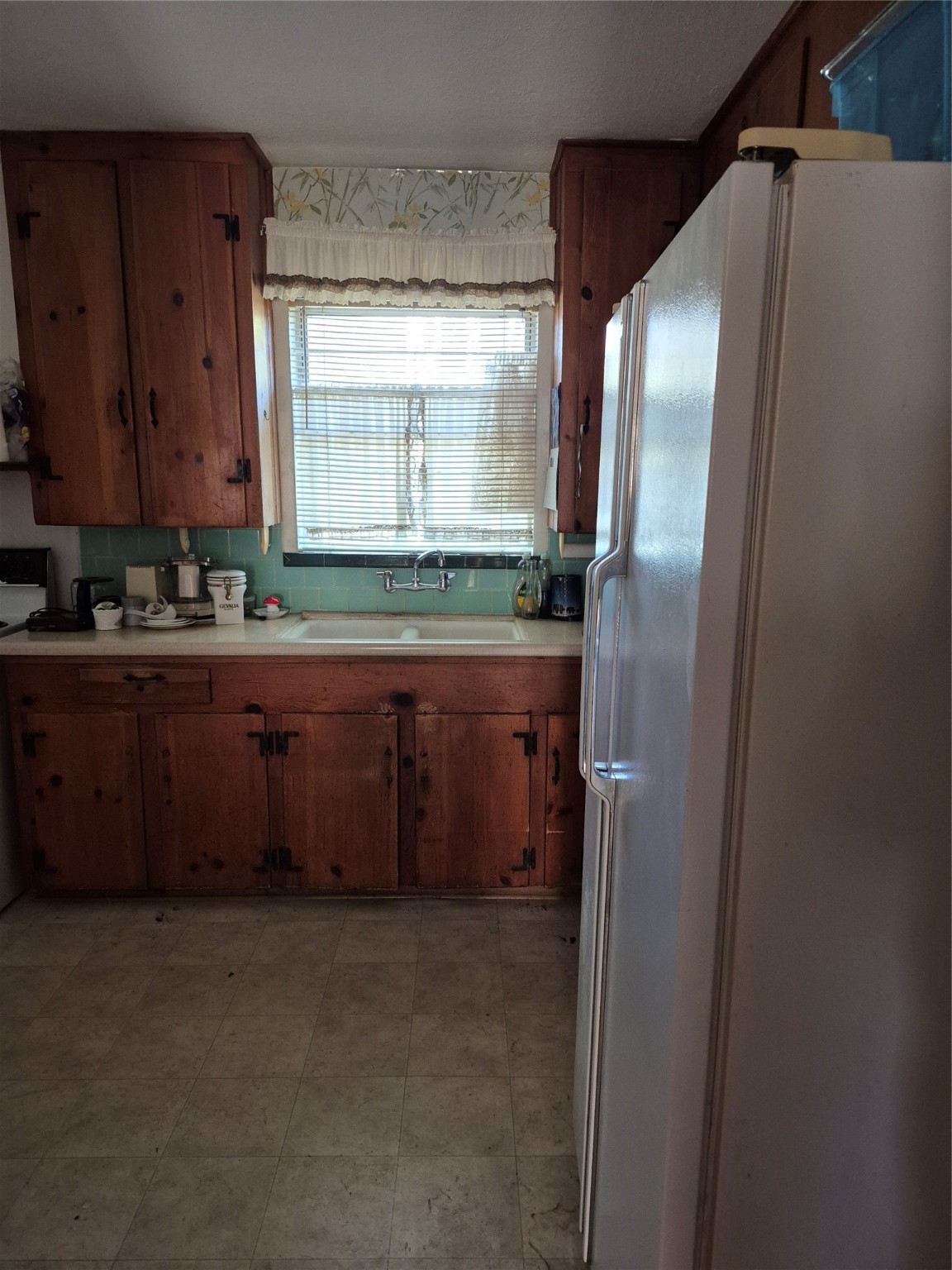 8046 Turquoise Lane Houston, TX 77055 - Photo 4 of 8 a kitchen with stainless steel appliances granite countertop a refrigerator and a sink