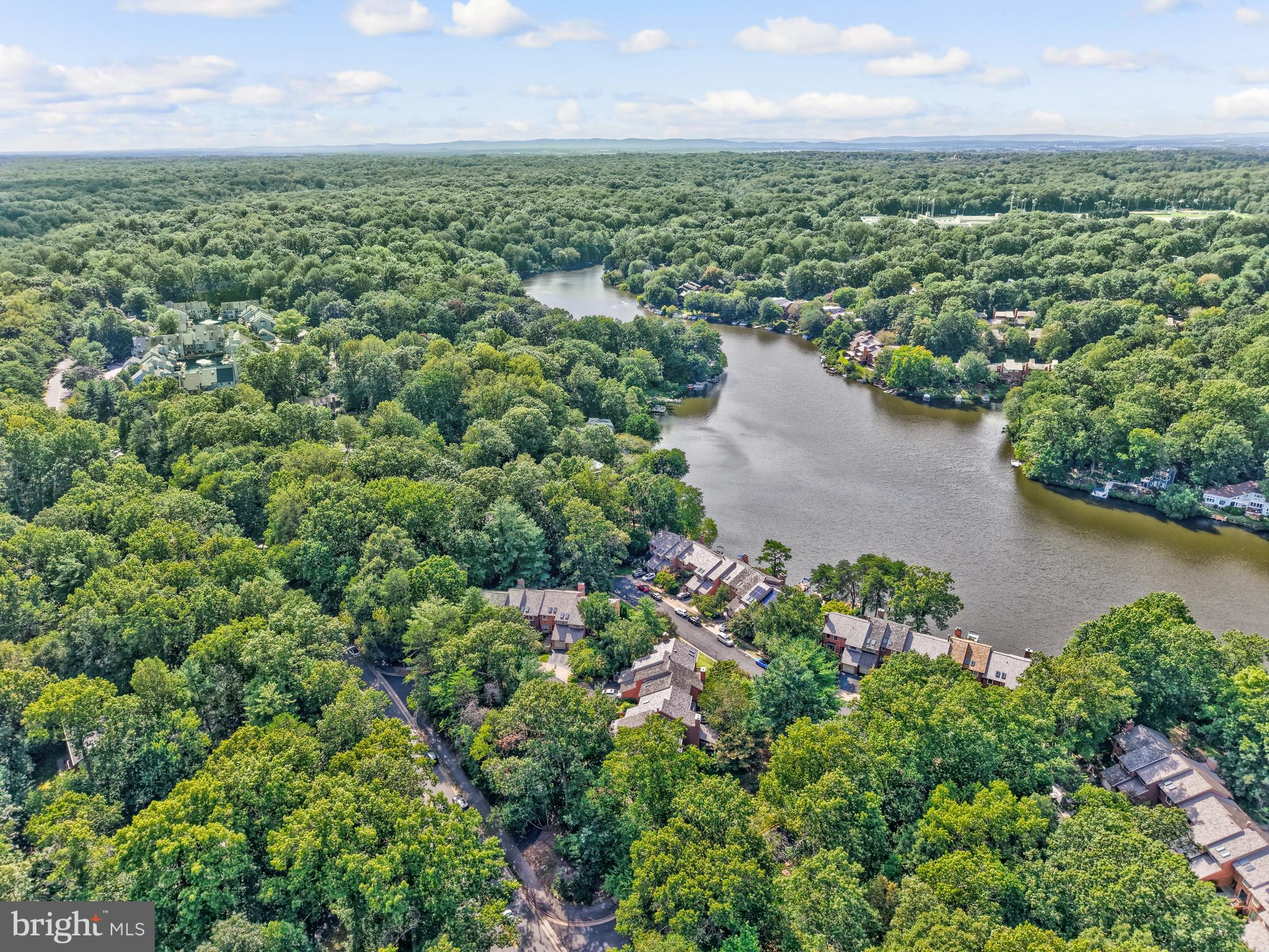 11088 Glade Court Reston, VA 20191 - Photo 58 of 75 a view of a lake with a city