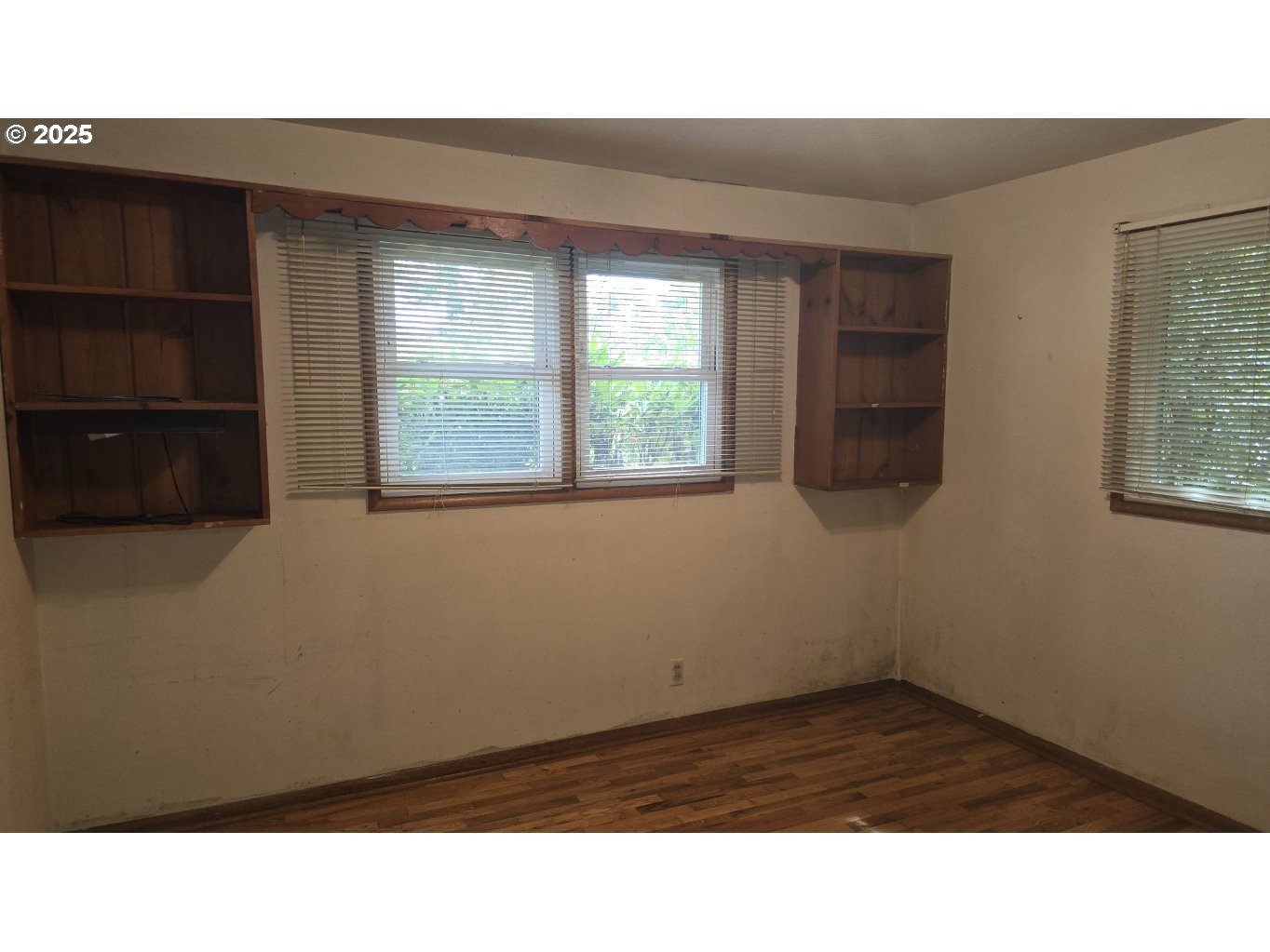 19520 Southwest Kinnaman Road Beaverton, OR 97078 - Photo 15 of 47 a room with a window and wooden floor