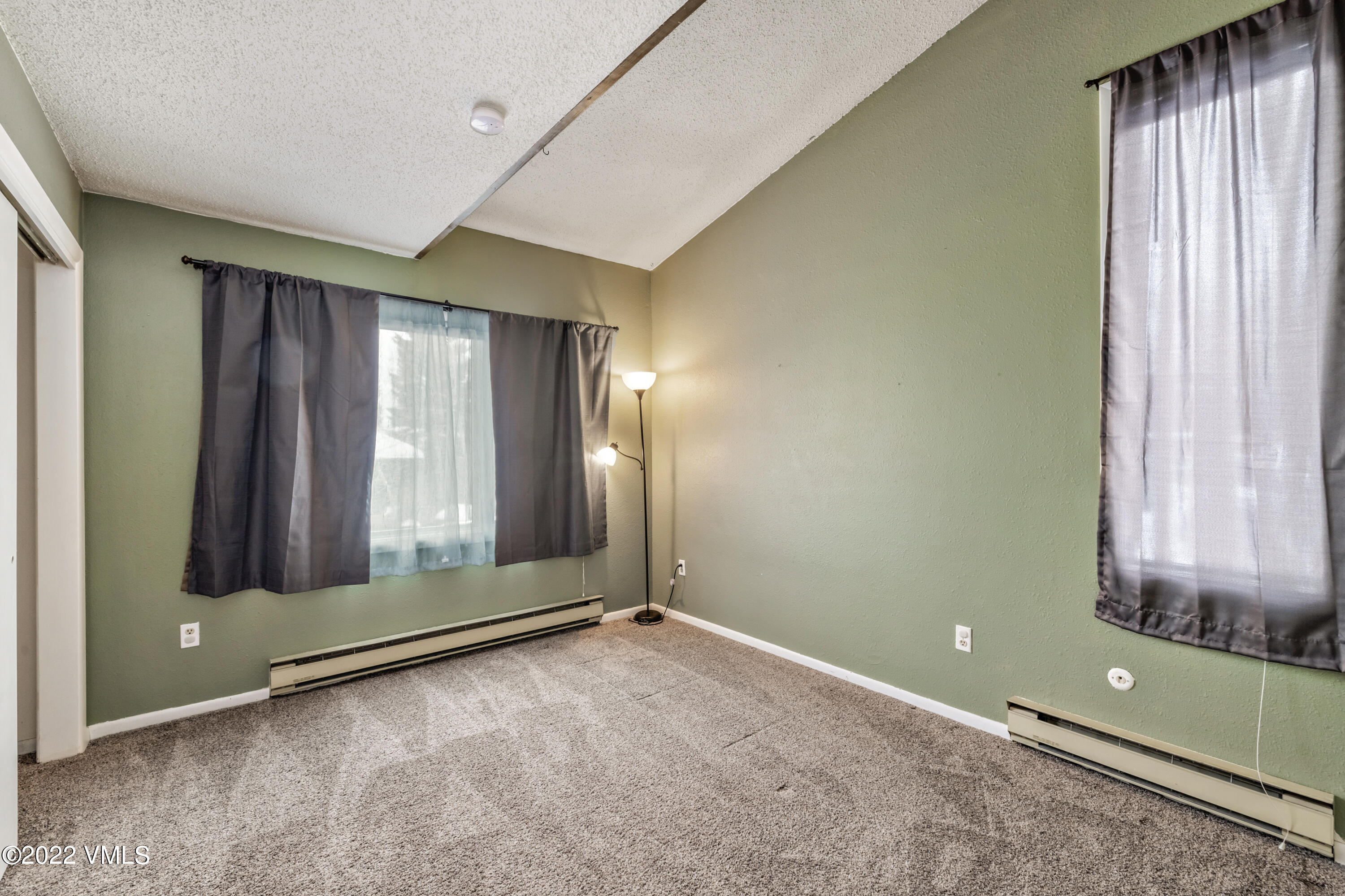 225 Gopher Road, Unit 56 Avon, CO 81620 - Photo 12 of 20 an empty room with window and closet area