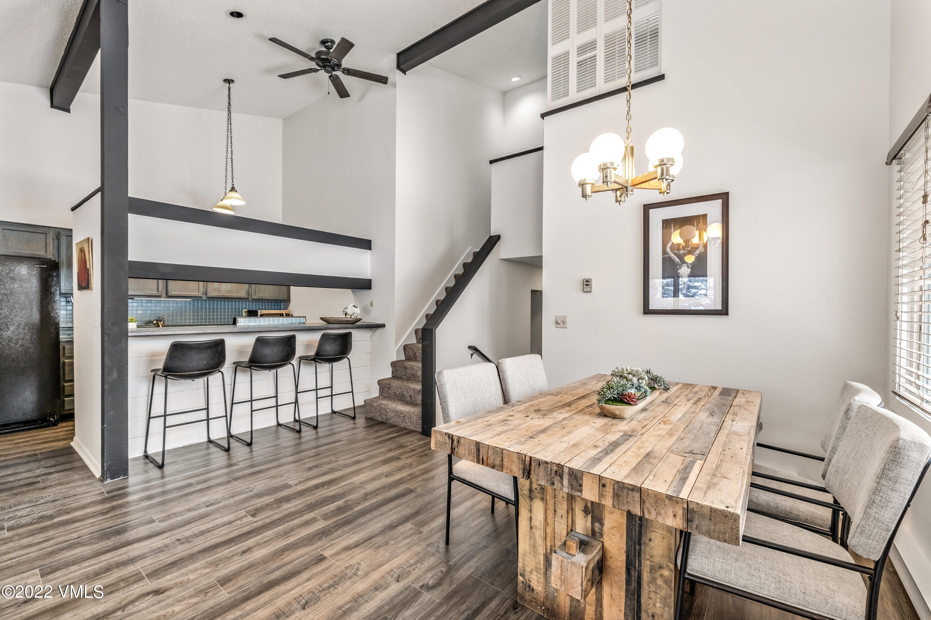 225 Gopher Road, Unit 56 Avon, CO 81620 - Photo 13 of 20 a view of a dining room with furniture and wooden floor