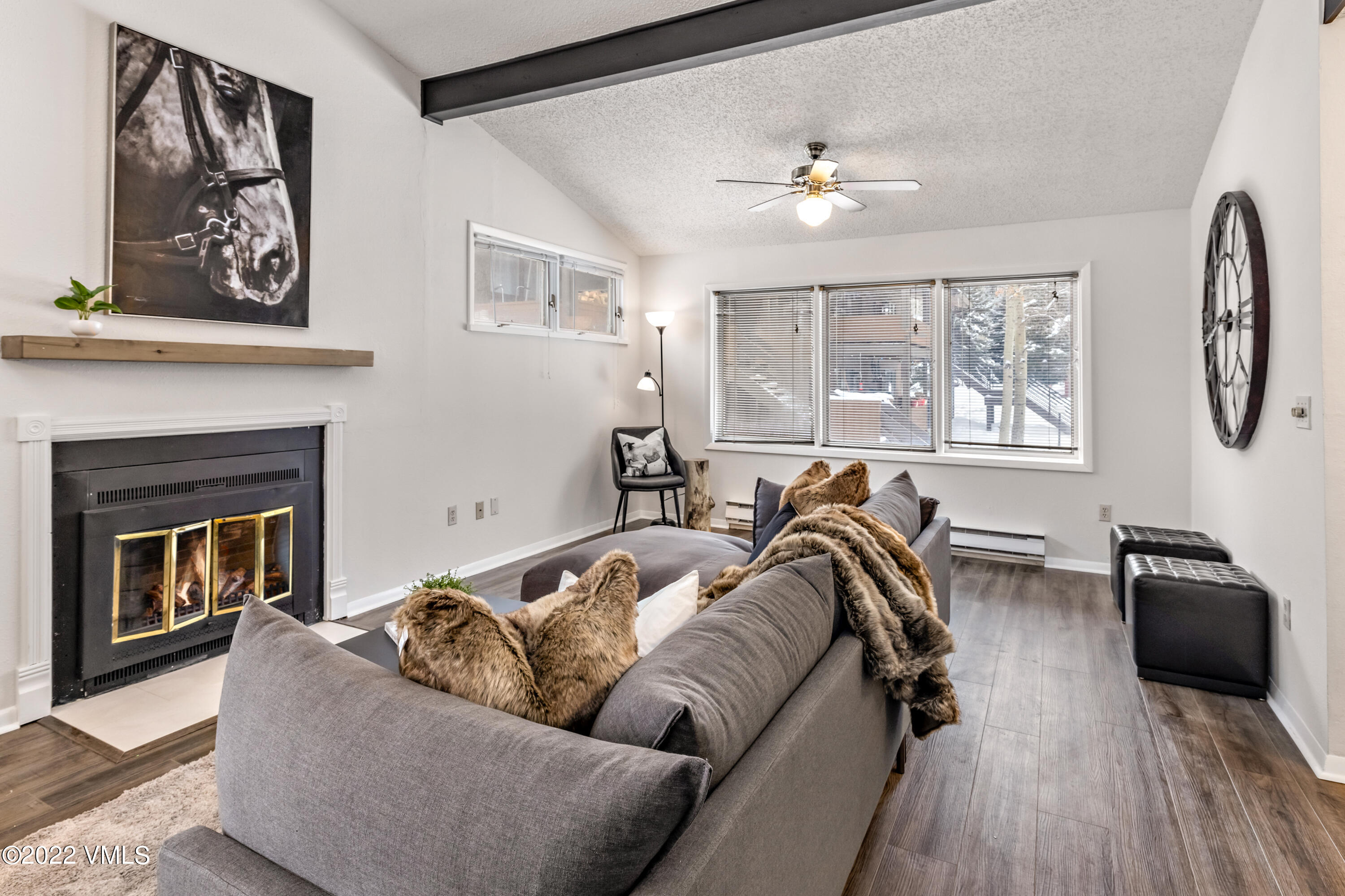 225 Gopher Road, Unit 56 Avon, CO 81620 - Photo 15 of 20 a living room with furniture and a fireplace