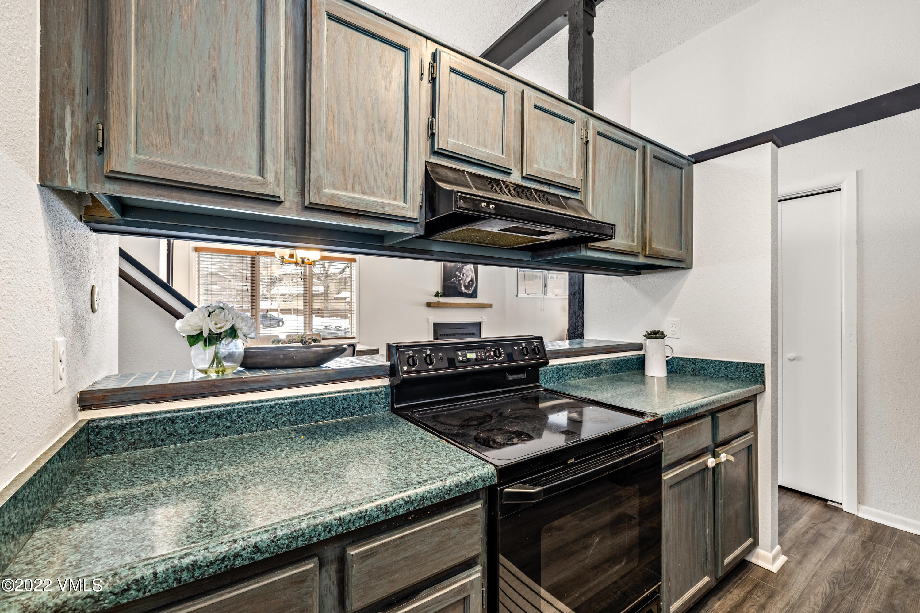 225 Gopher Road, Unit 56 Avon, CO 81620 - Photo 5 of 20 a kitchen with stainless steel appliances granite countertop a stove and a sink