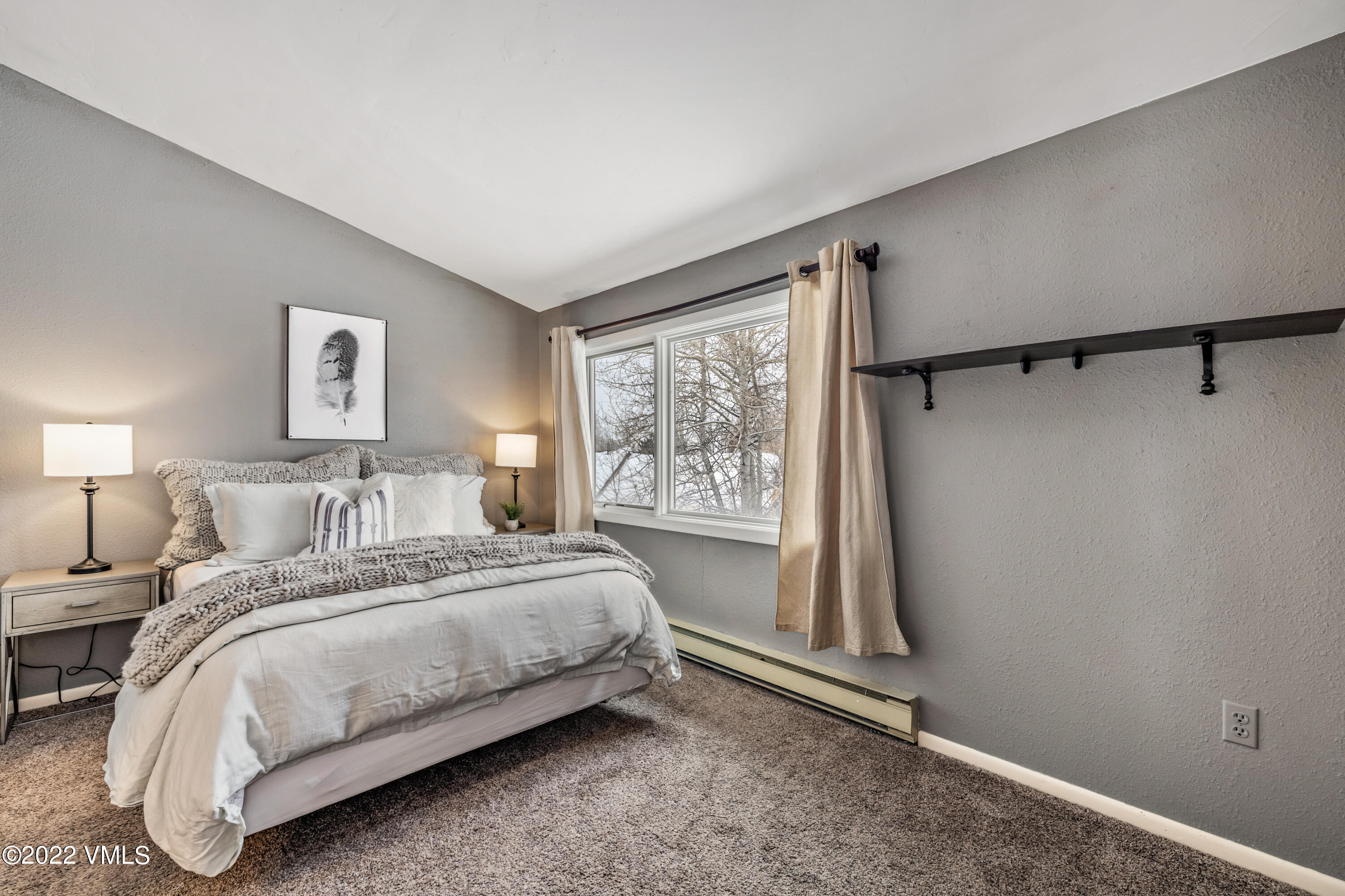 225 Gopher Road, Unit 56 Avon, CO 81620 - Photo 8 of 20 a bedroom with a bed and a window