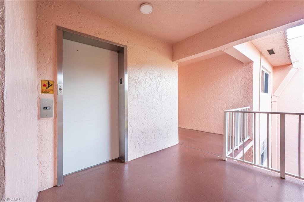 100 Forest Lakes Boulevard, Unit 305 Naples, FL 34105 - Photo 16 of 31 Property entrance featuring elevator