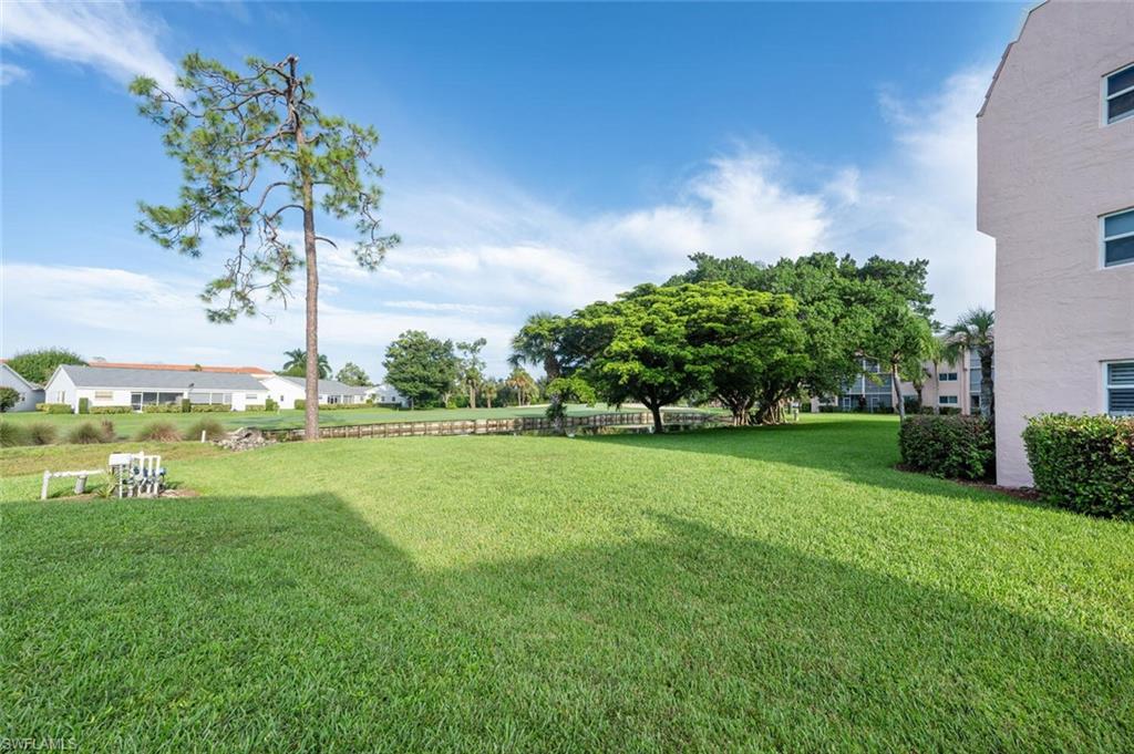 100 Forest Lakes Boulevard, Unit 305 Naples, FL 34105 - Photo 17 of 31 View of yard