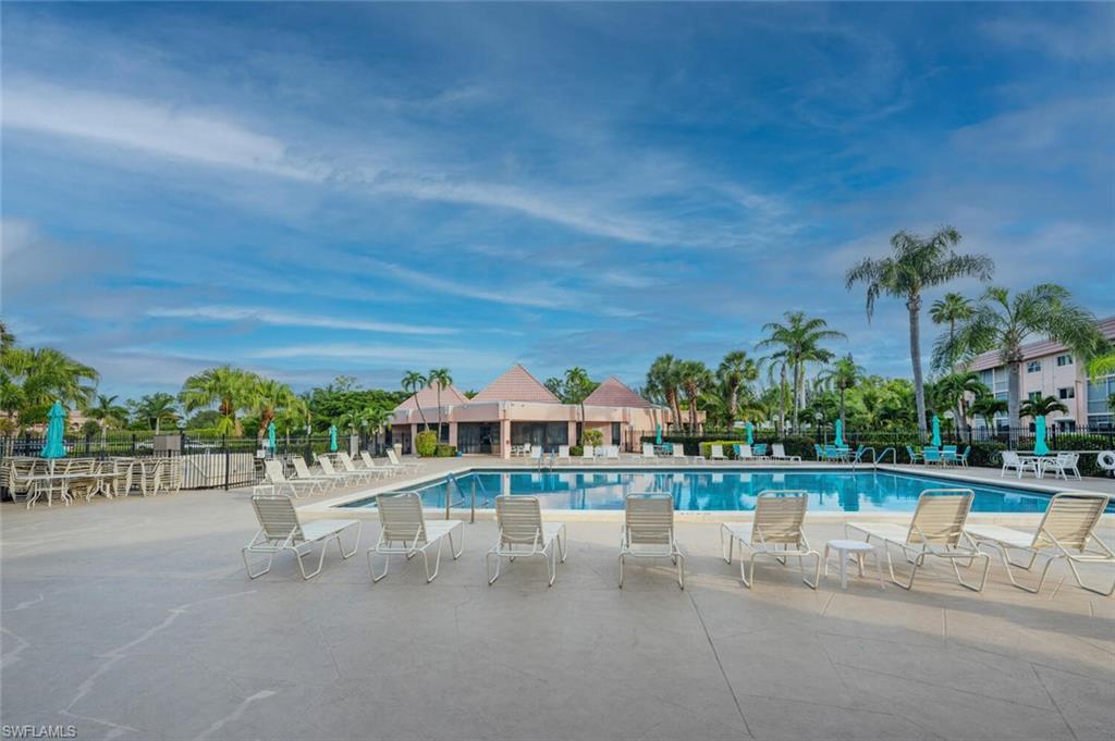 100 Forest Lakes Boulevard, Unit 305 Naples, FL 34105 - Photo 24 of 31 View of pool featuring a patio