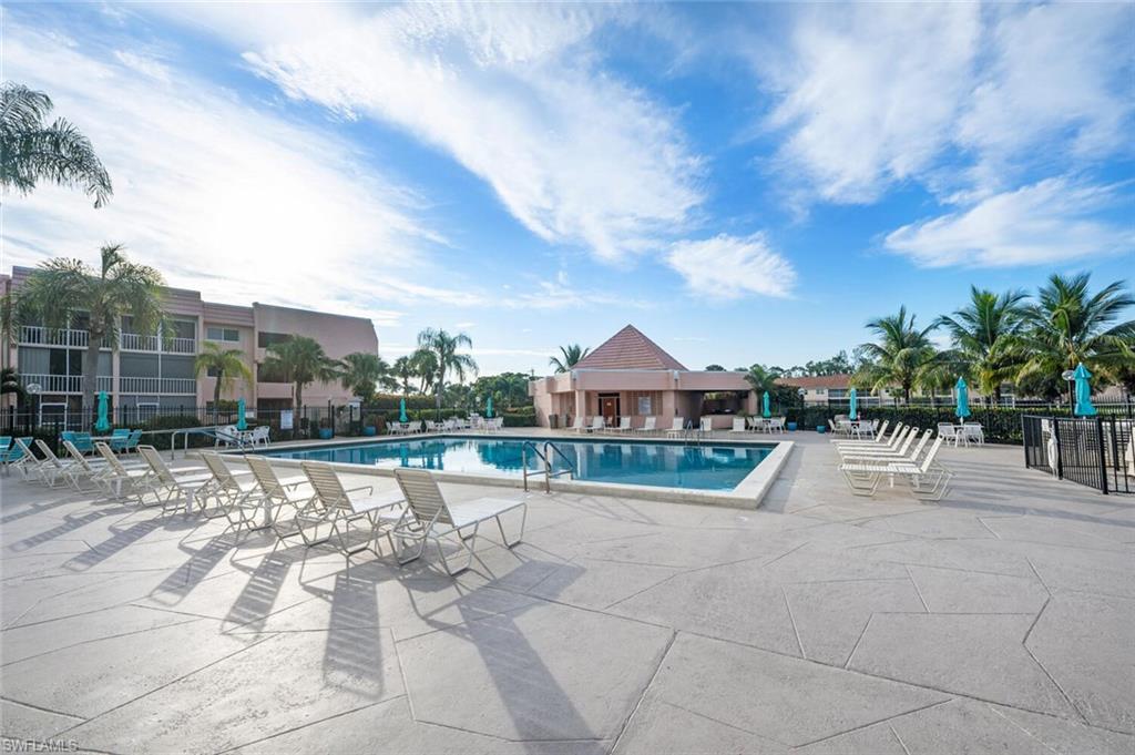 100 Forest Lakes Boulevard, Unit 305 Naples, FL 34105 - Photo 25 of 31 View of pool featuring a patio area