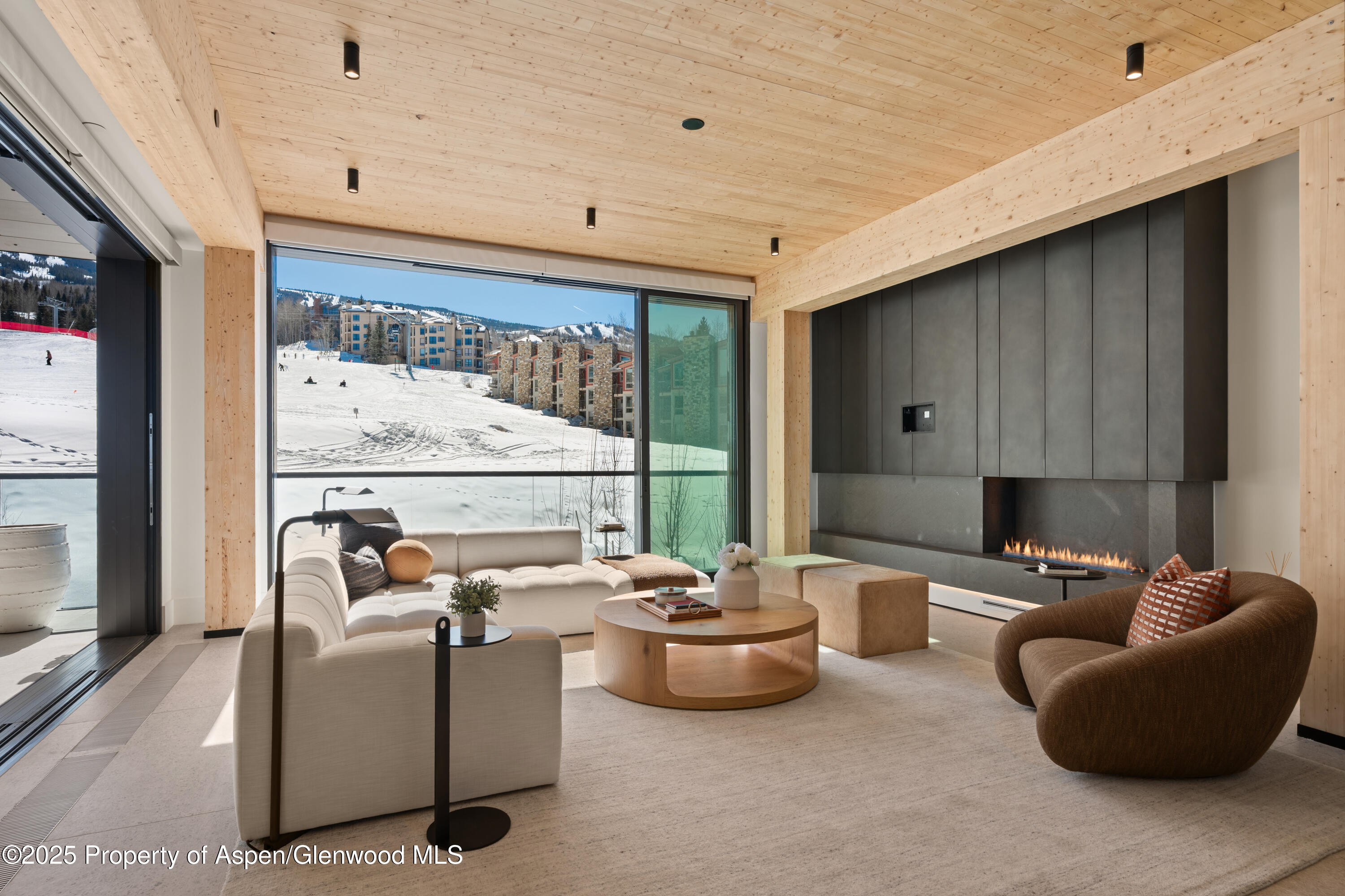 180 Wood Road, Unit 304 Snowmass Village, CO 81615 - Photo 13 of 61 a room with furniture and a large window