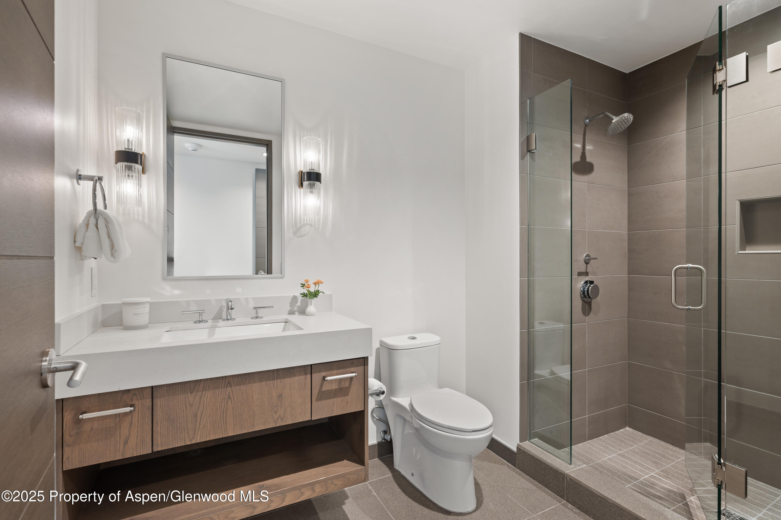 180 Wood Road, Unit 304 Snowmass Village, CO 81615 - Photo 33 of 61 a bathroom with a sink toilet and shower