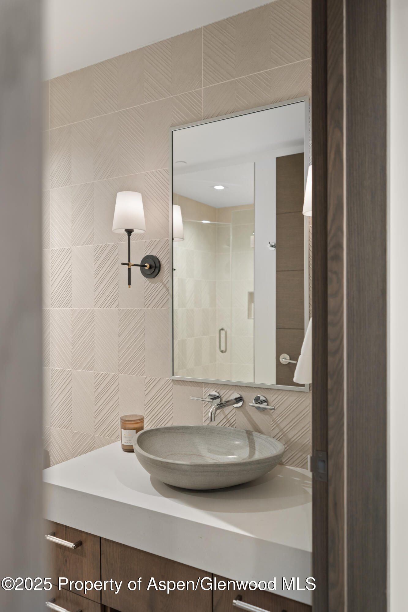 180 Wood Road, Unit 304 Snowmass Village, CO 81615 - Photo 36 of 61 a bathroom with a sink and a mirror