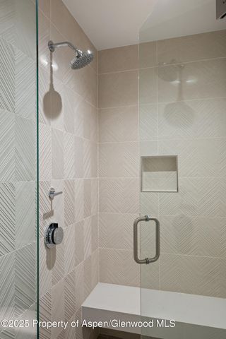 a view of a patio with a table and chairs