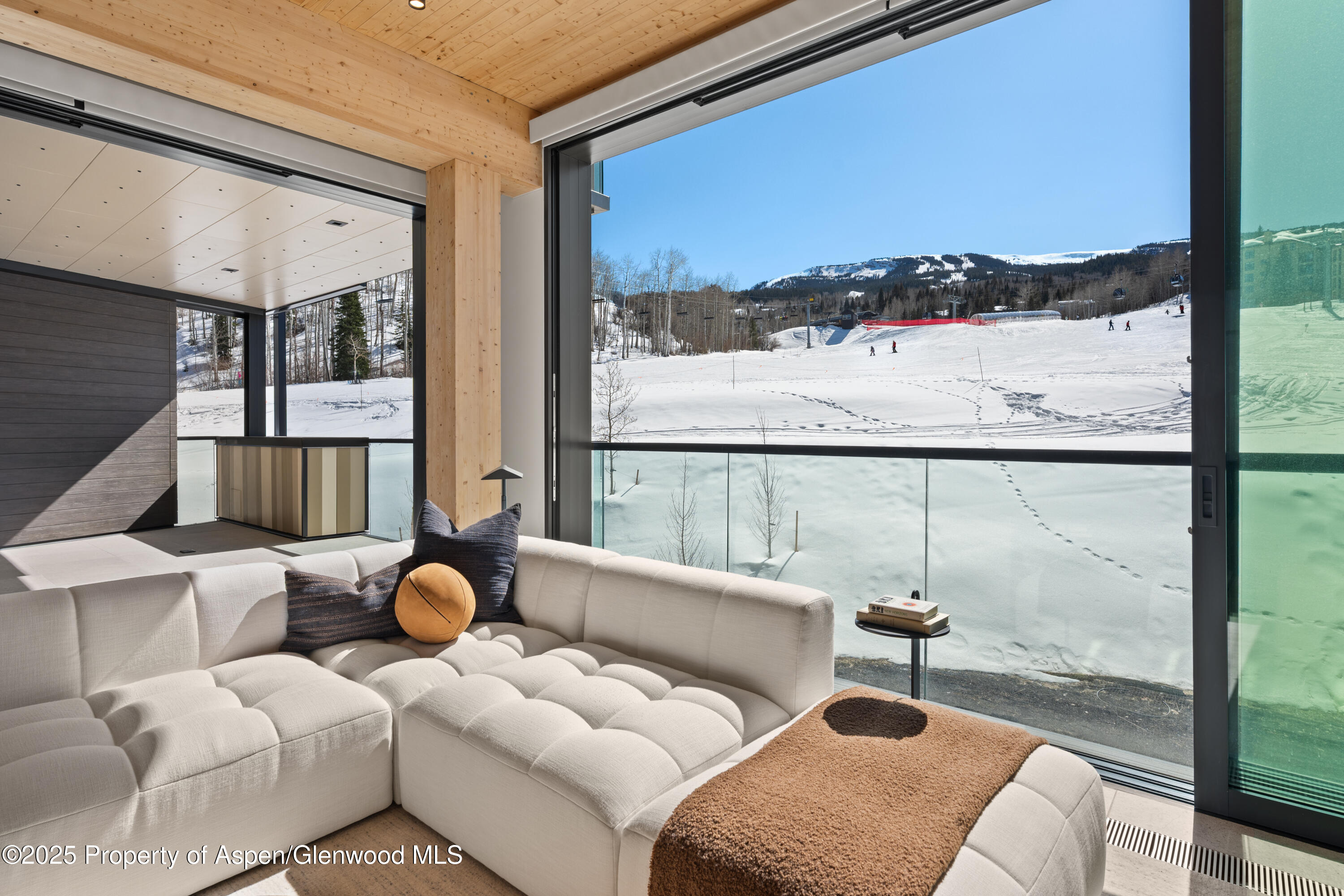 180 Wood Road, Unit 304 Snowmass Village, CO 81615 - Photo 8 of 61 a living room with furniture and a large window