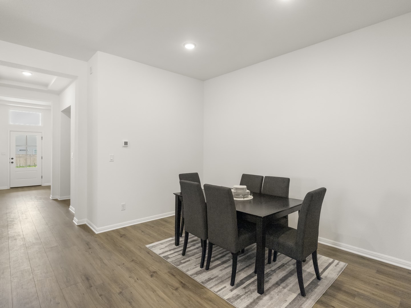 402 Judson Street Bertram, TX 78605 - Photo 10 of 27 a view of a dining room with furniture and wooden floor