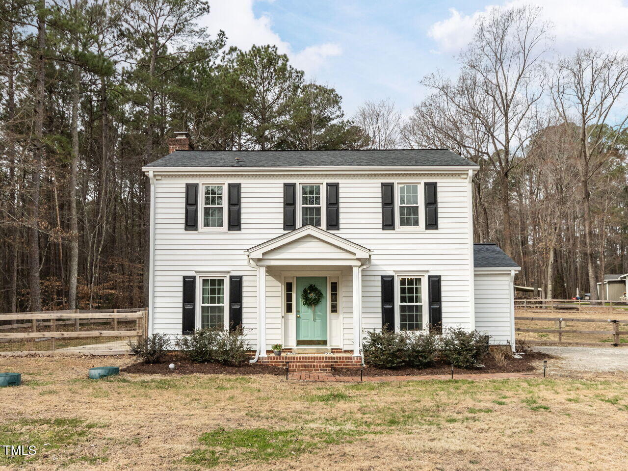 a front view of a house with yard