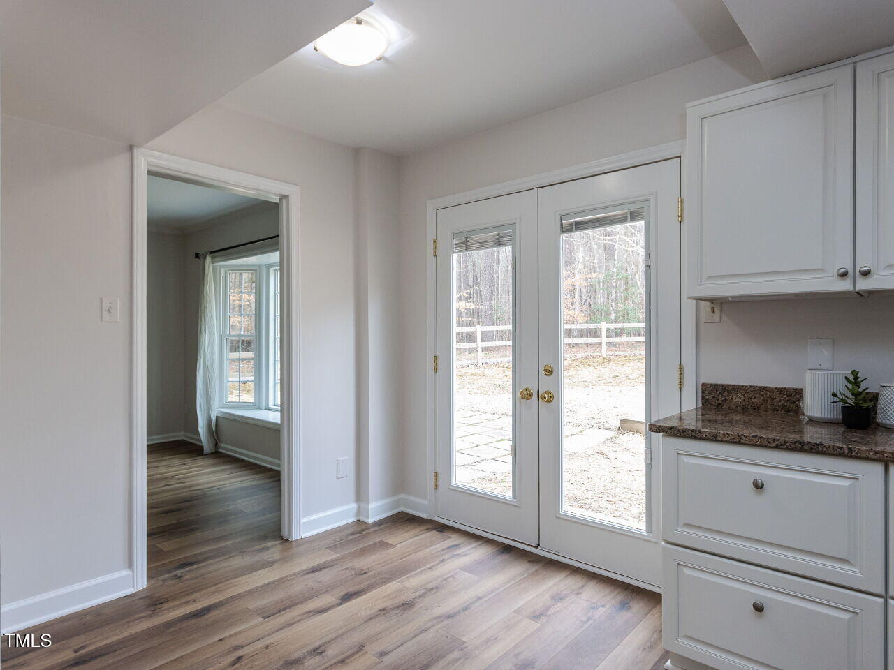 7408 Stable End Road Raleigh, NC 27613 - Photo 16 of 39 a view of cabinets and wooden floor