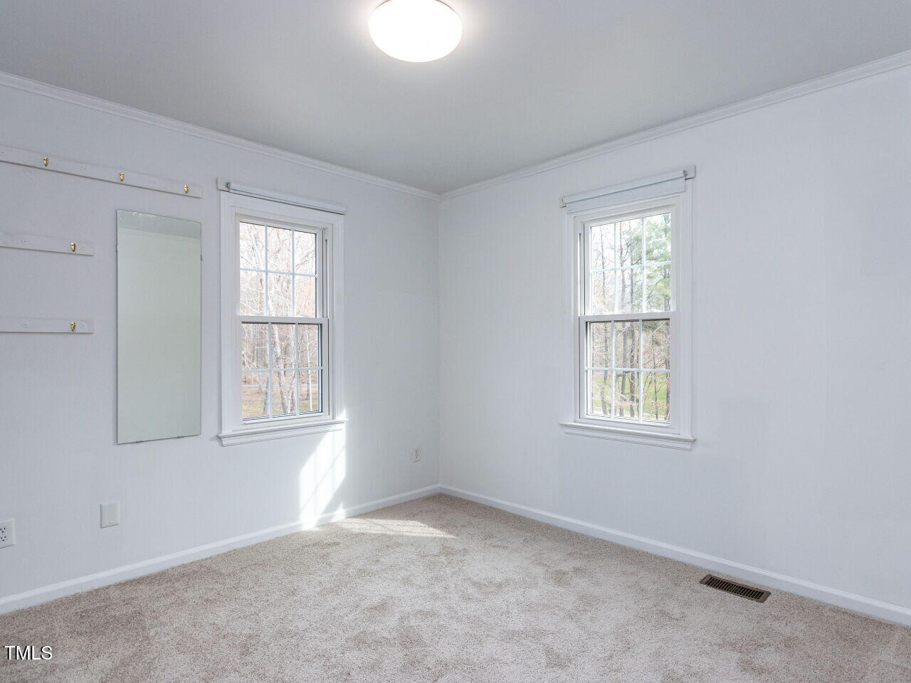 7408 Stable End Road Raleigh, NC 27613 - Photo 29 of 39 an empty room with windows
