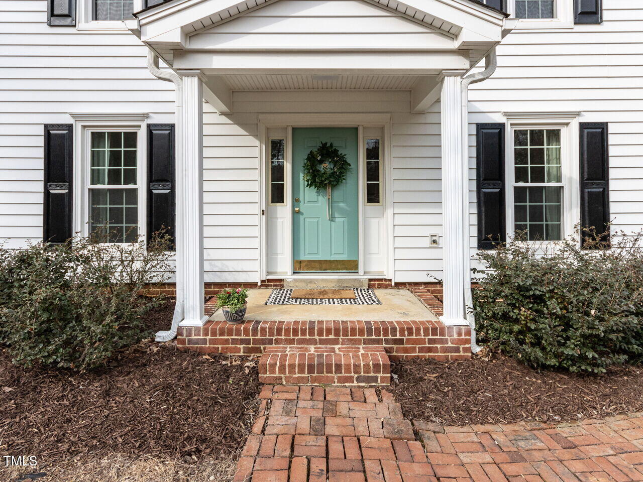 7408 Stable End Road Raleigh, NC 27613 - Photo 3 of 39 a front view of a house