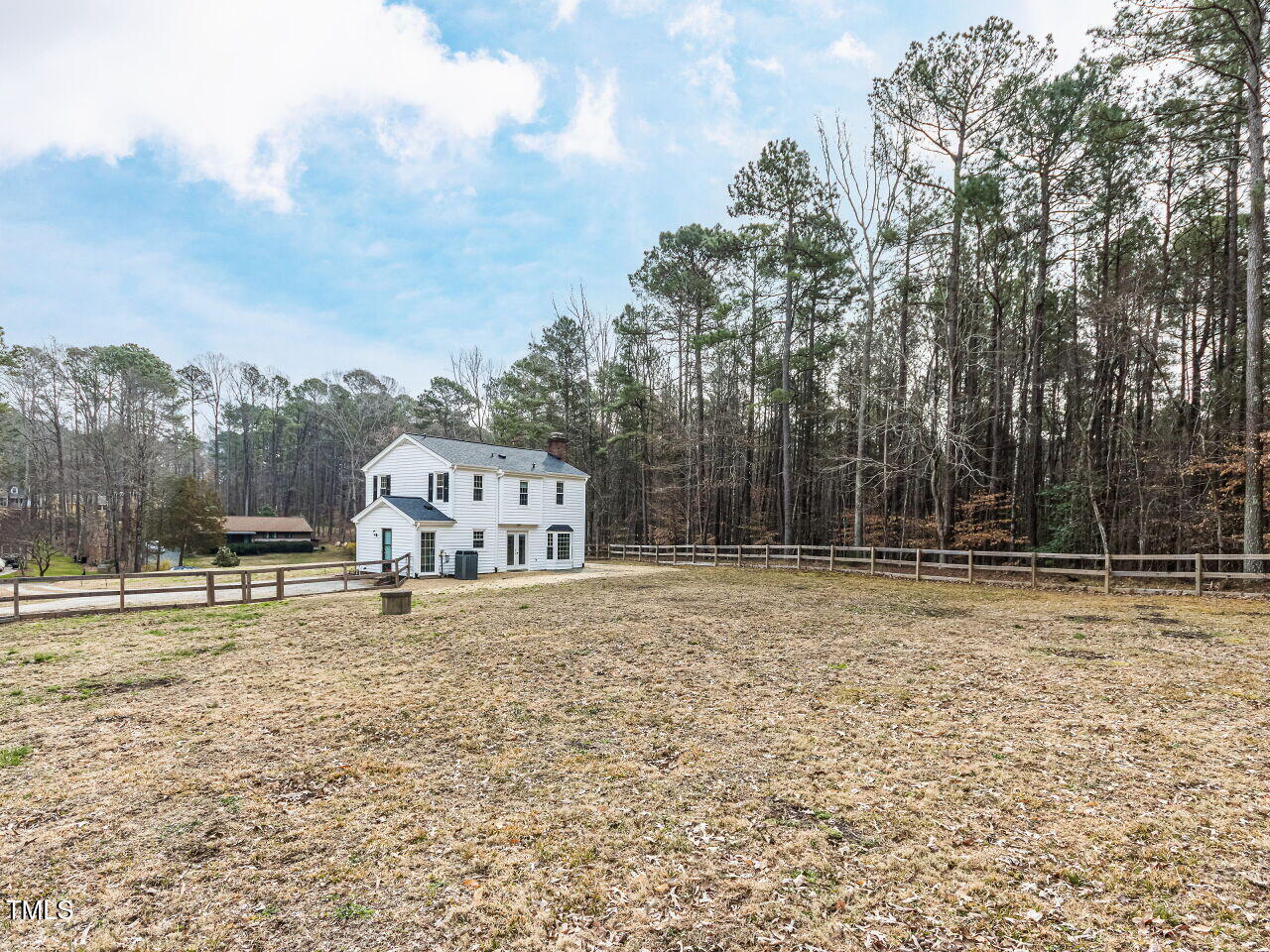 7408 Stable End Road Raleigh, NC 27613 - Photo 33 of 39 a house with trees in the background