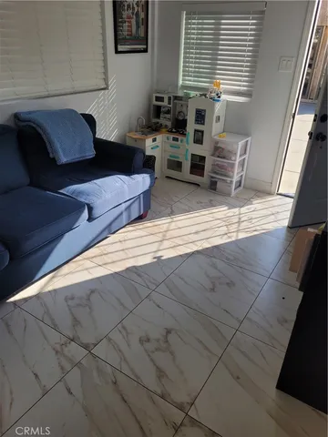 a living room with furniture and a window