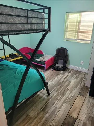 a room with pool table and windows