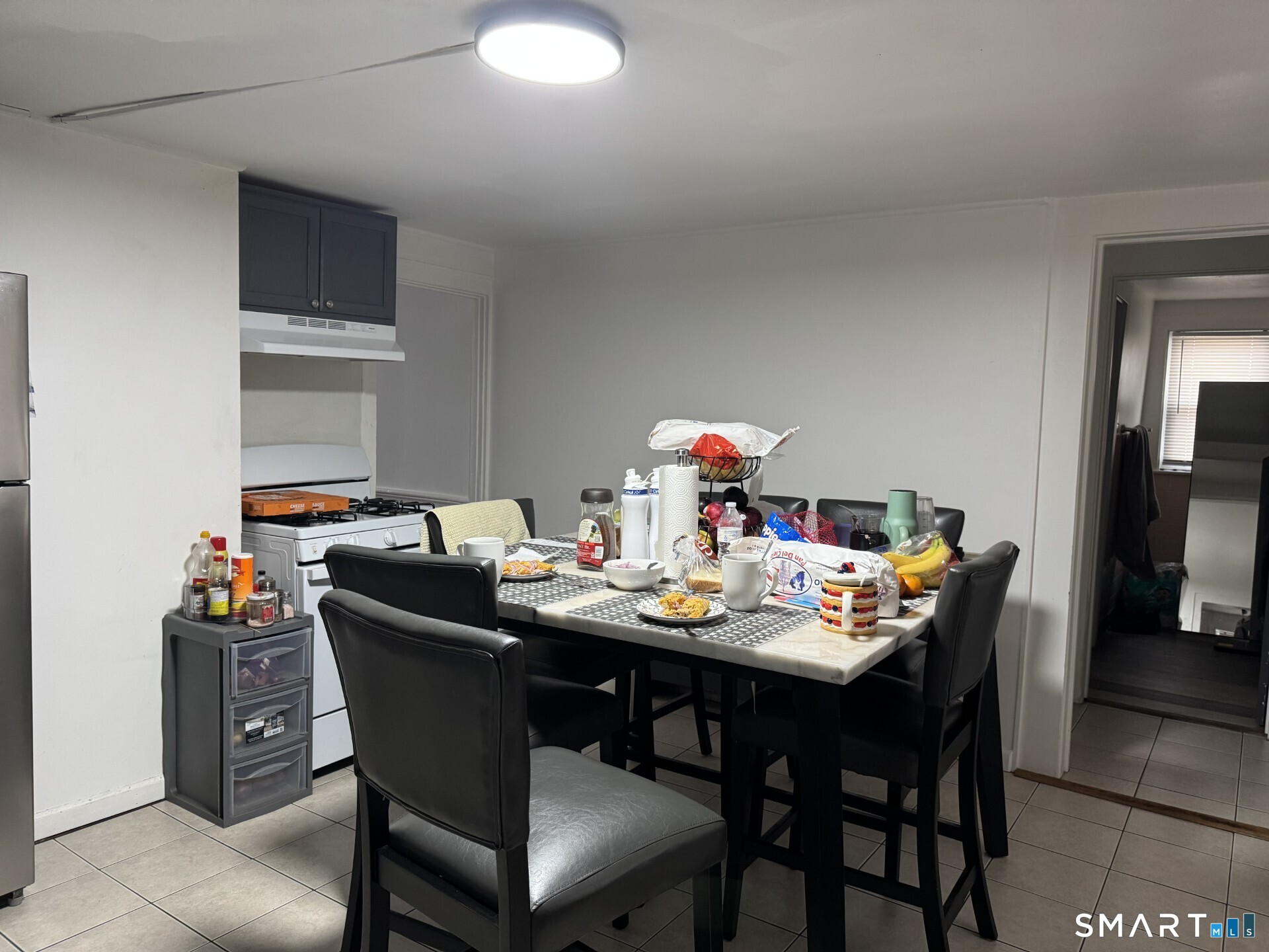 34-36 Cottage Street Manchester, CT 06040 - Photo 11 of 40 a dining room with furniture and window