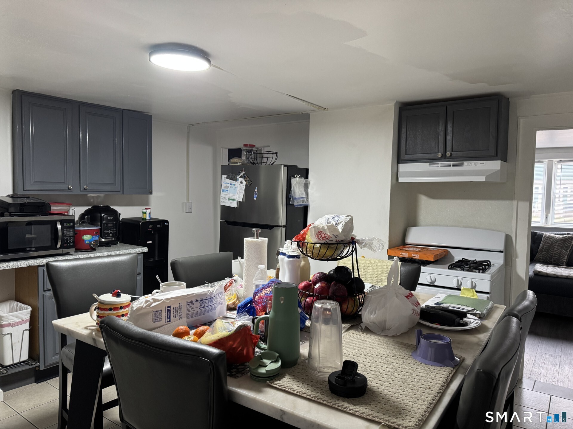 34-36 Cottage Street Manchester, CT 06040 - Photo 12 of 40 a kitchen with a dining table and chairs