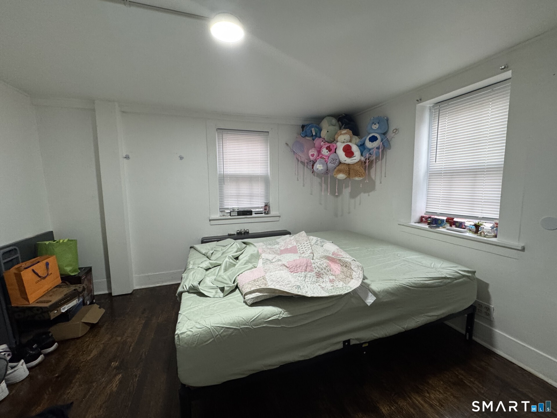 34-36 Cottage Street Manchester, CT 06040 - Photo 16 of 40 a living room with furniture and a window