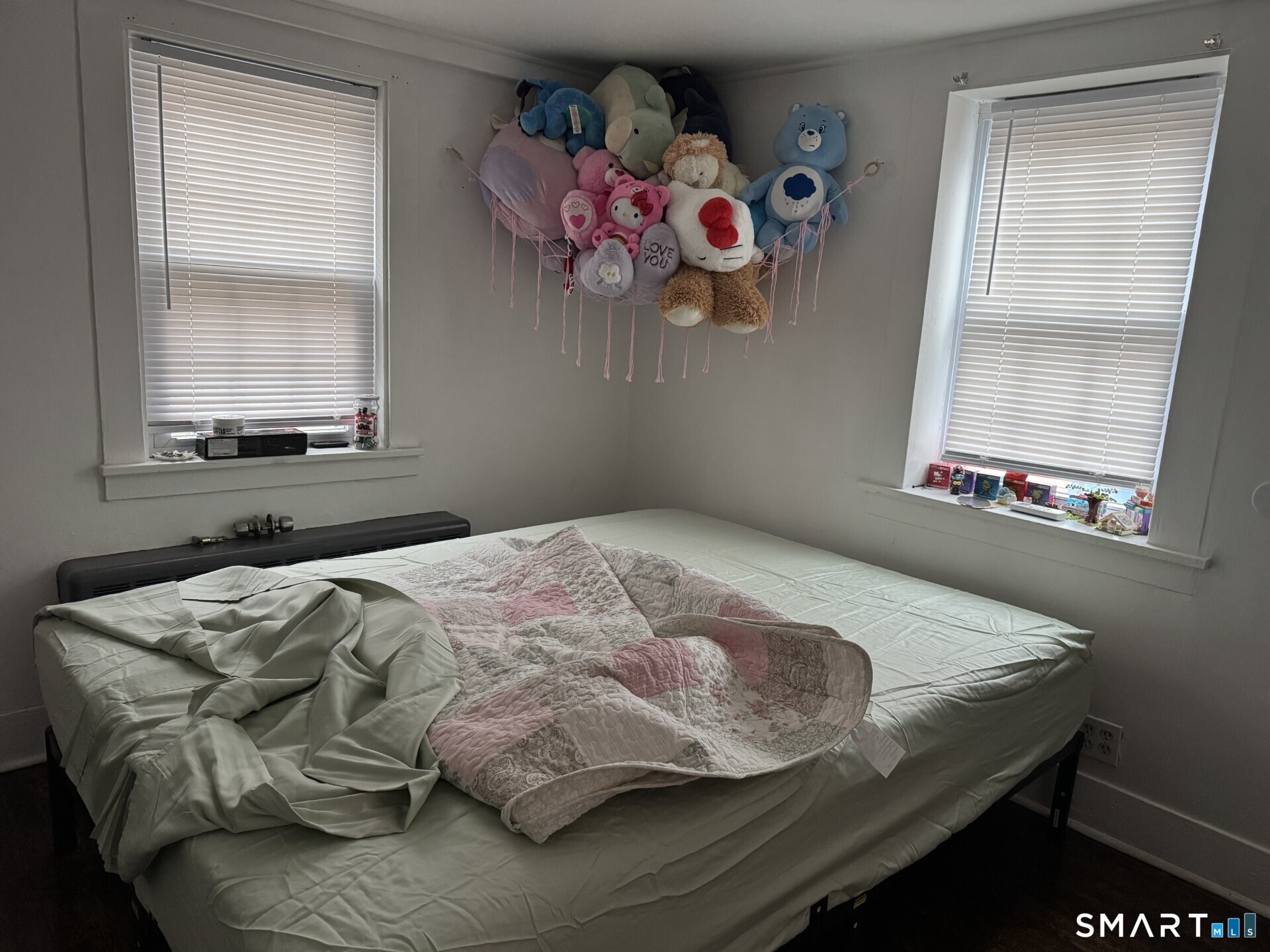 34-36 Cottage Street Manchester, CT 06040 - Photo 17 of 40 a bedroom with a bed and window