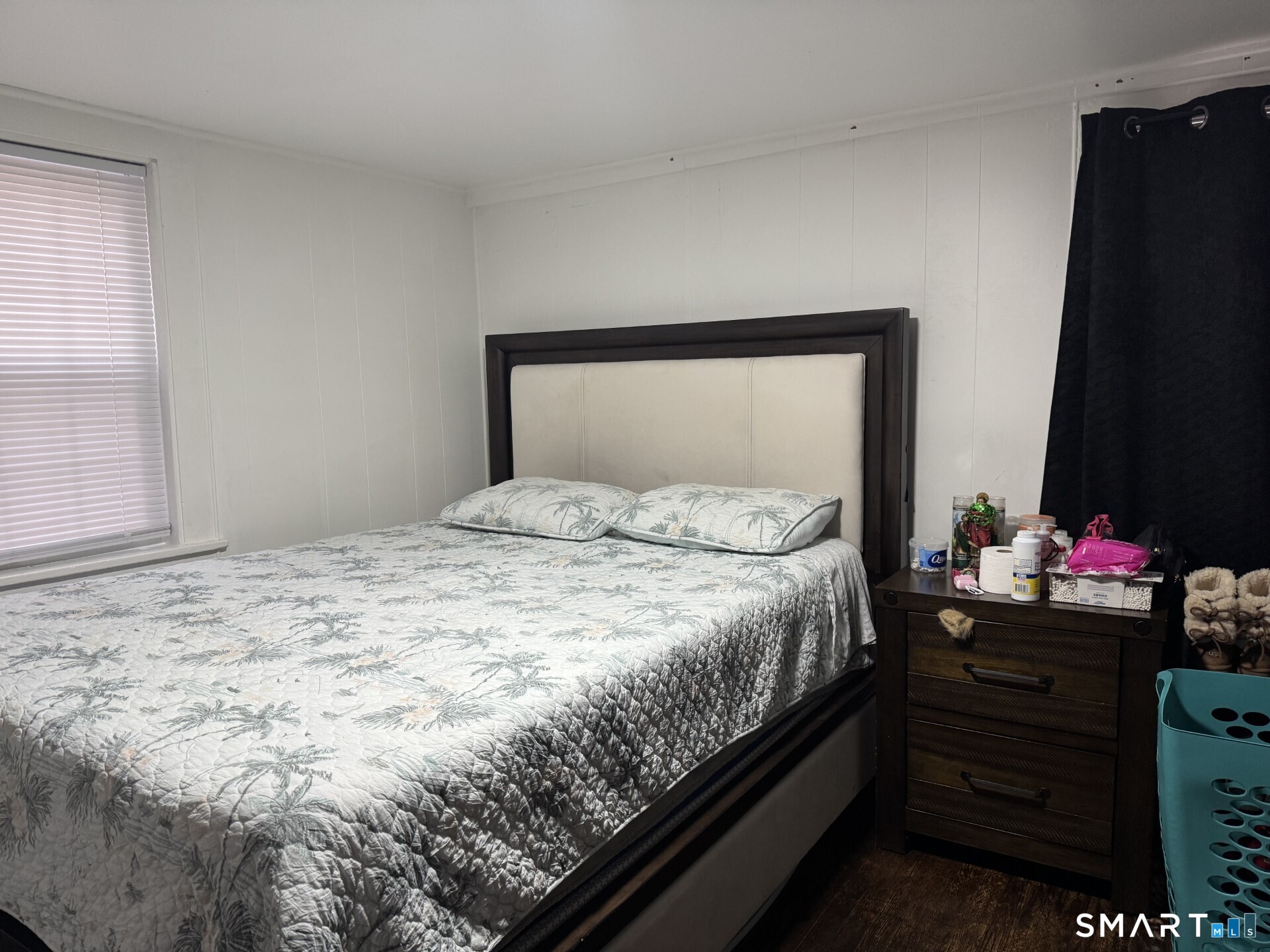 34-36 Cottage Street Manchester, CT 06040 - Photo 18 of 40 a bedroom with a bed and a flat tv screen on a dresser