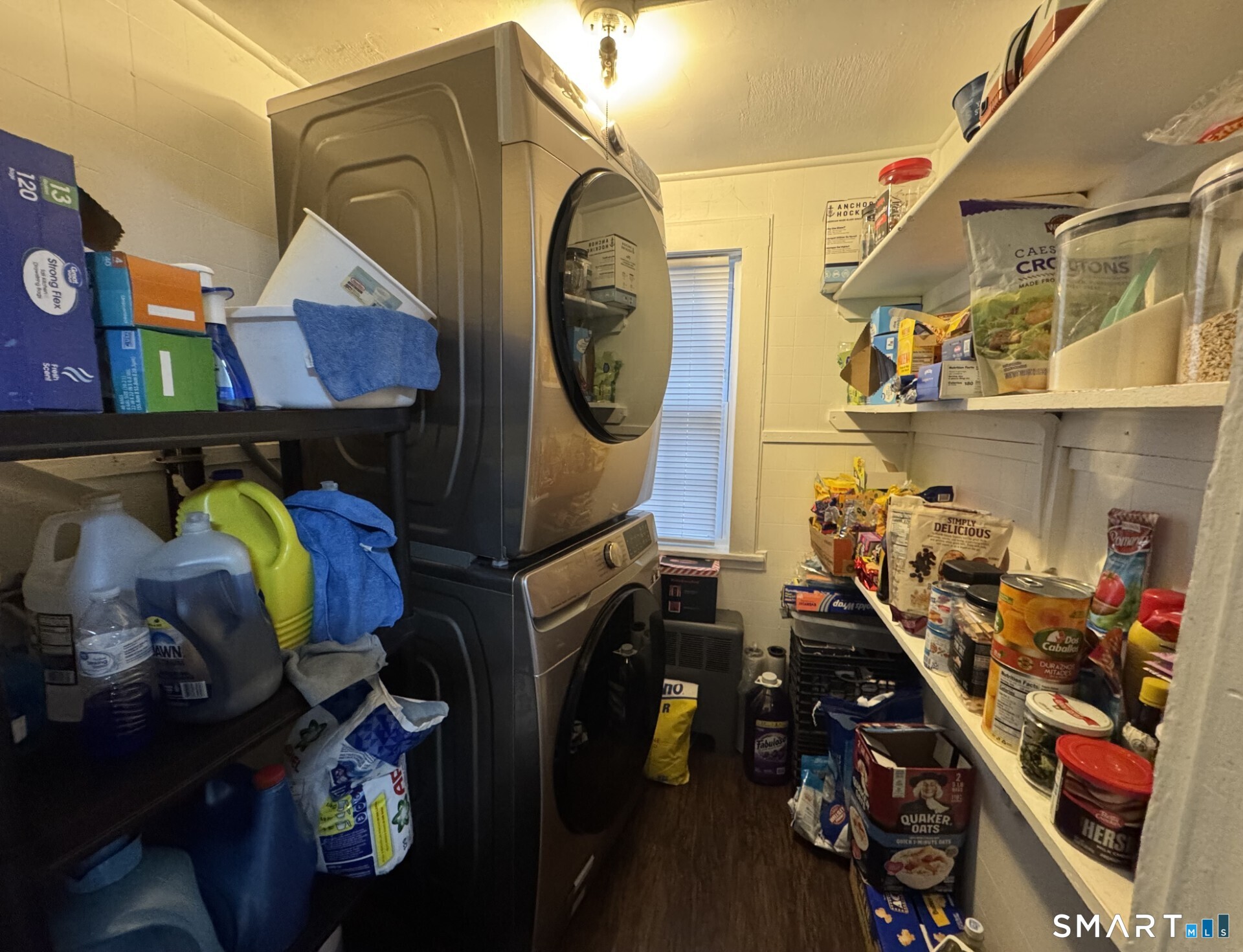 34-36 Cottage Street Manchester, CT 06040 - Photo 21 of 40 a utility room with lots of clutter and white cabinets