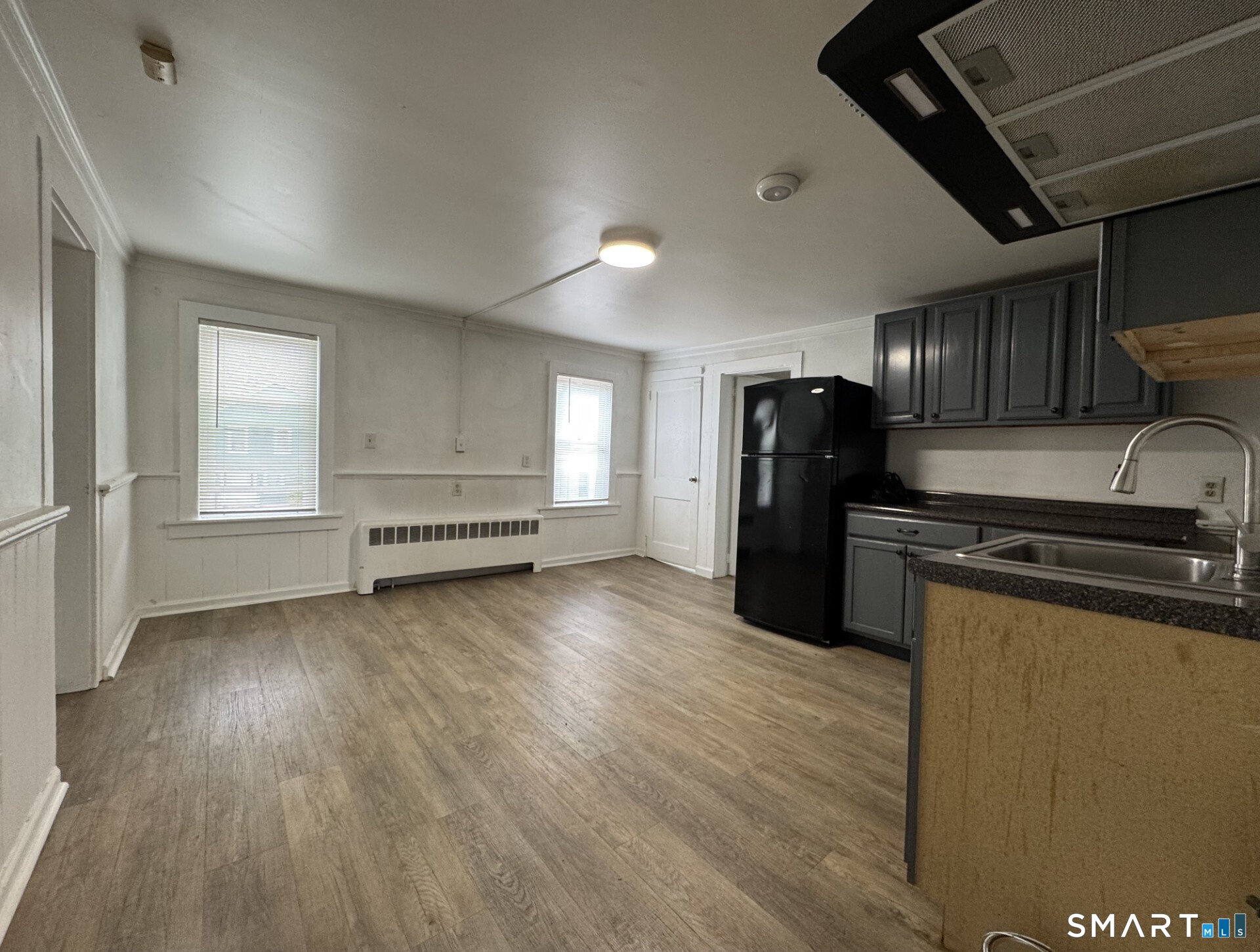 34-36 Cottage Street Manchester, CT 06040 - Photo 23 of 40 a kitchen with stainless steel appliances granite countertop a refrigerator and a stove top oven