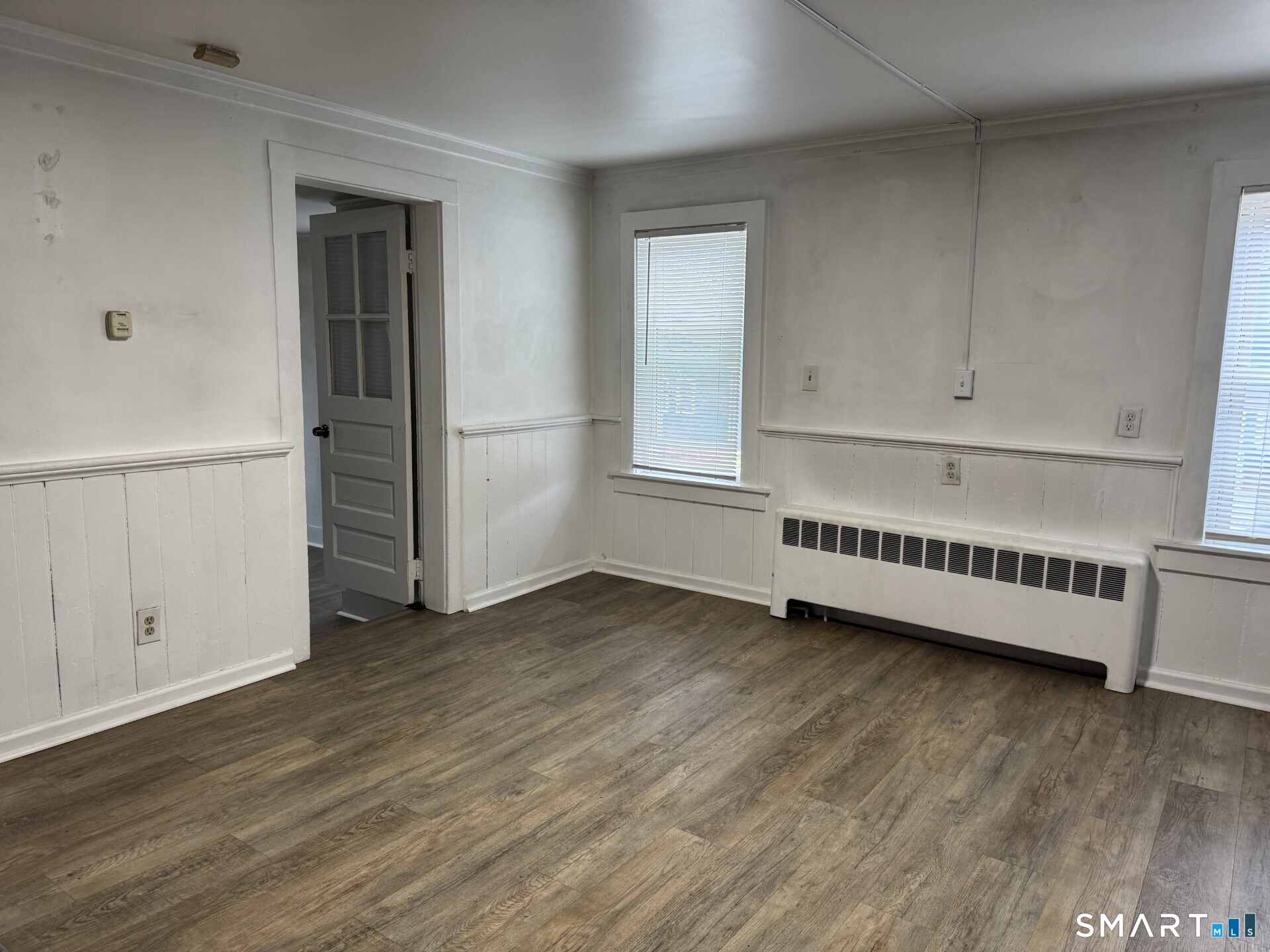 34-36 Cottage Street Manchester, CT 06040 - Photo 28 of 40 an empty room with wooden floor and windows