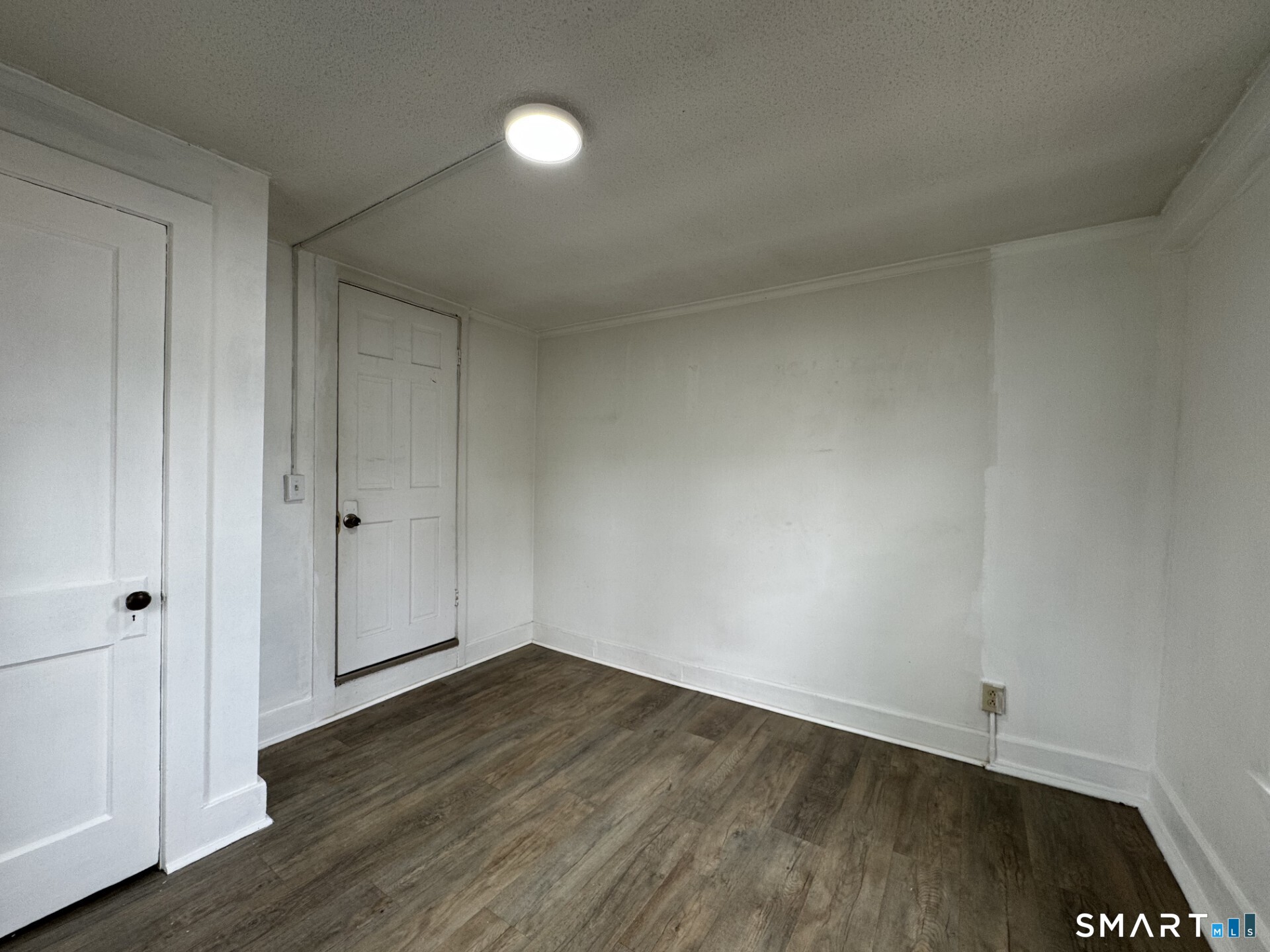 34-36 Cottage Street Manchester, CT 06040 - Photo 30 of 40 a view of an empty room and wooden floor