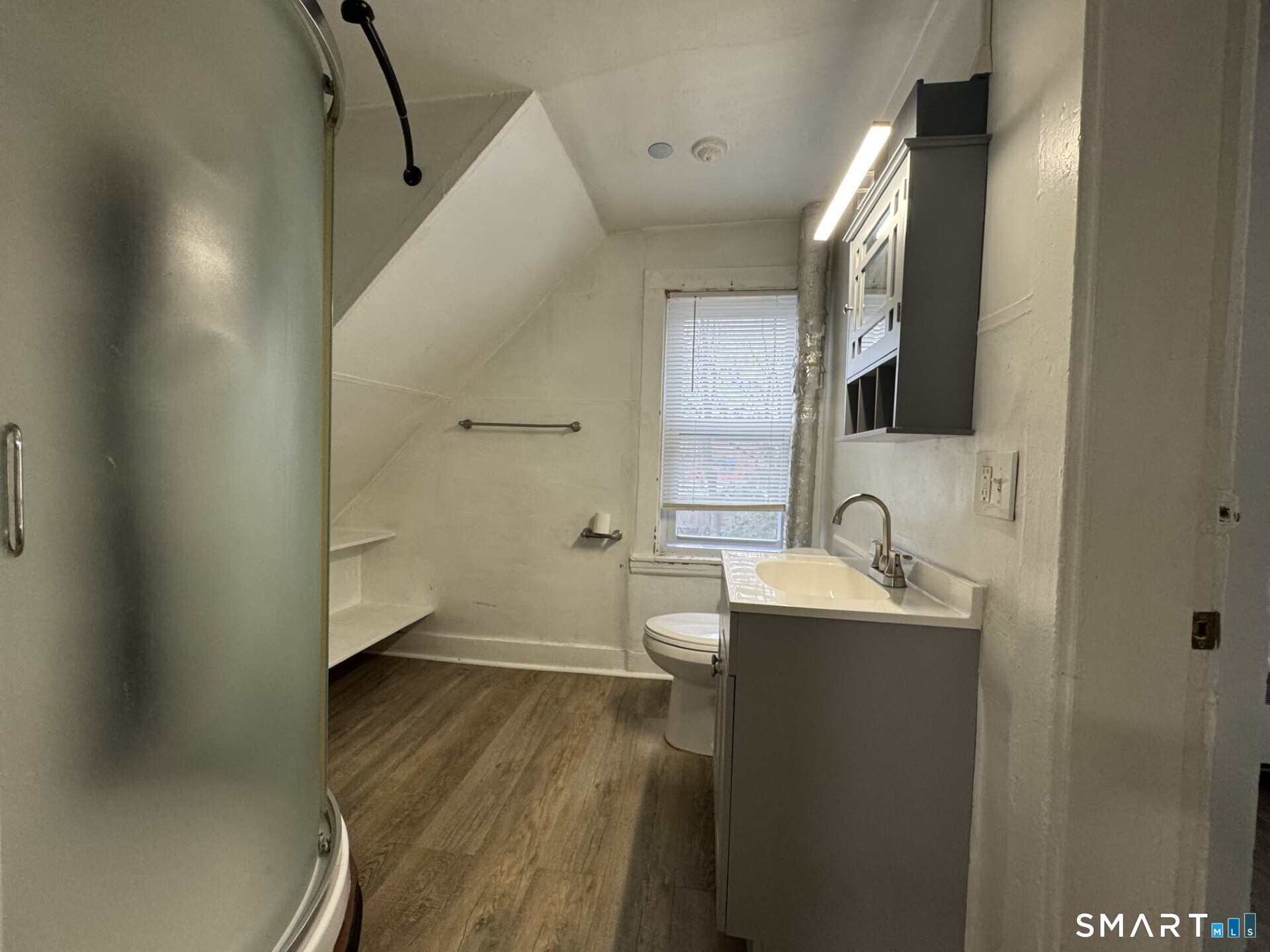 34-36 Cottage Street Manchester, CT 06040 - Photo 34 of 40 a bathroom with a sink and mirror with toilet