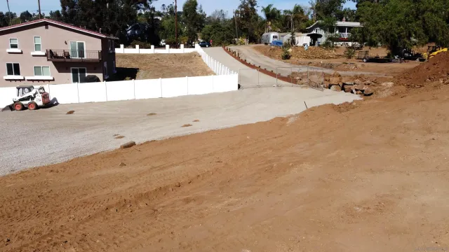 a view of a big yard with lots of green space