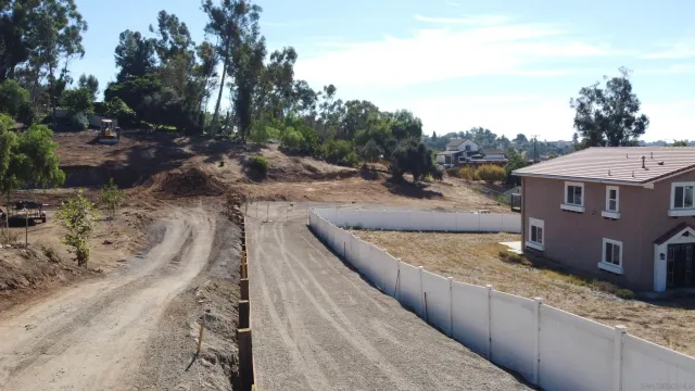 a view of a road with a yard