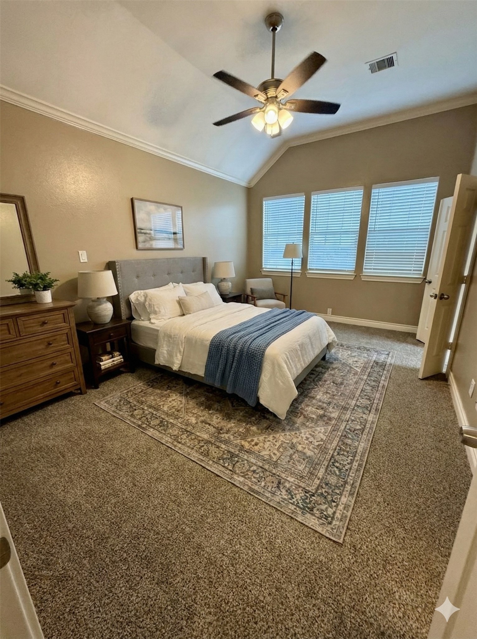 3540 Cline Street Houston, TX 77020 - Photo 4 of 26 a spacious bedroom with a large bed and a chandelier
