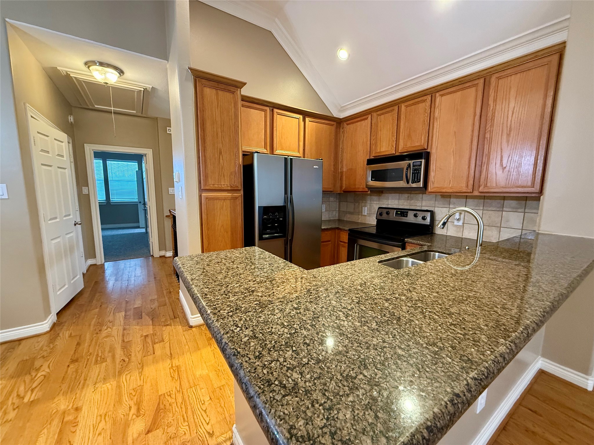 3540 Cline Street Houston, TX 77020 - Photo 9 of 26 a large kitchen with kitchen island granite countertop a sink stove and refrigerator