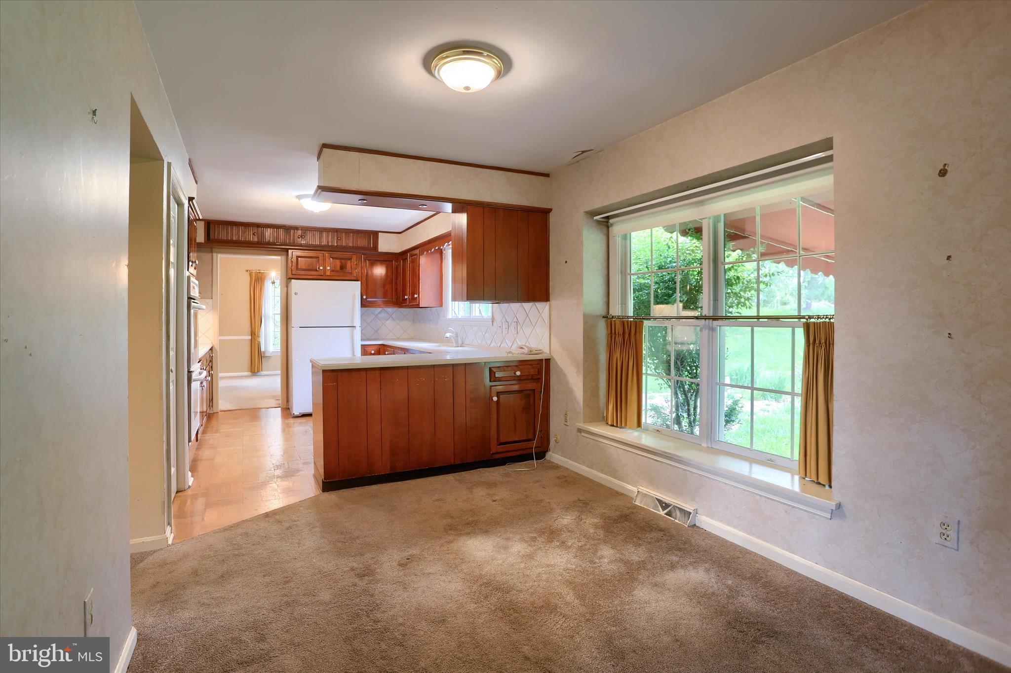 2919 Arcona Road Mechanicsburg, PA 17055 - Photo 15 of 49 a view of a kitchen with a sink and dishwasher with wooden floor