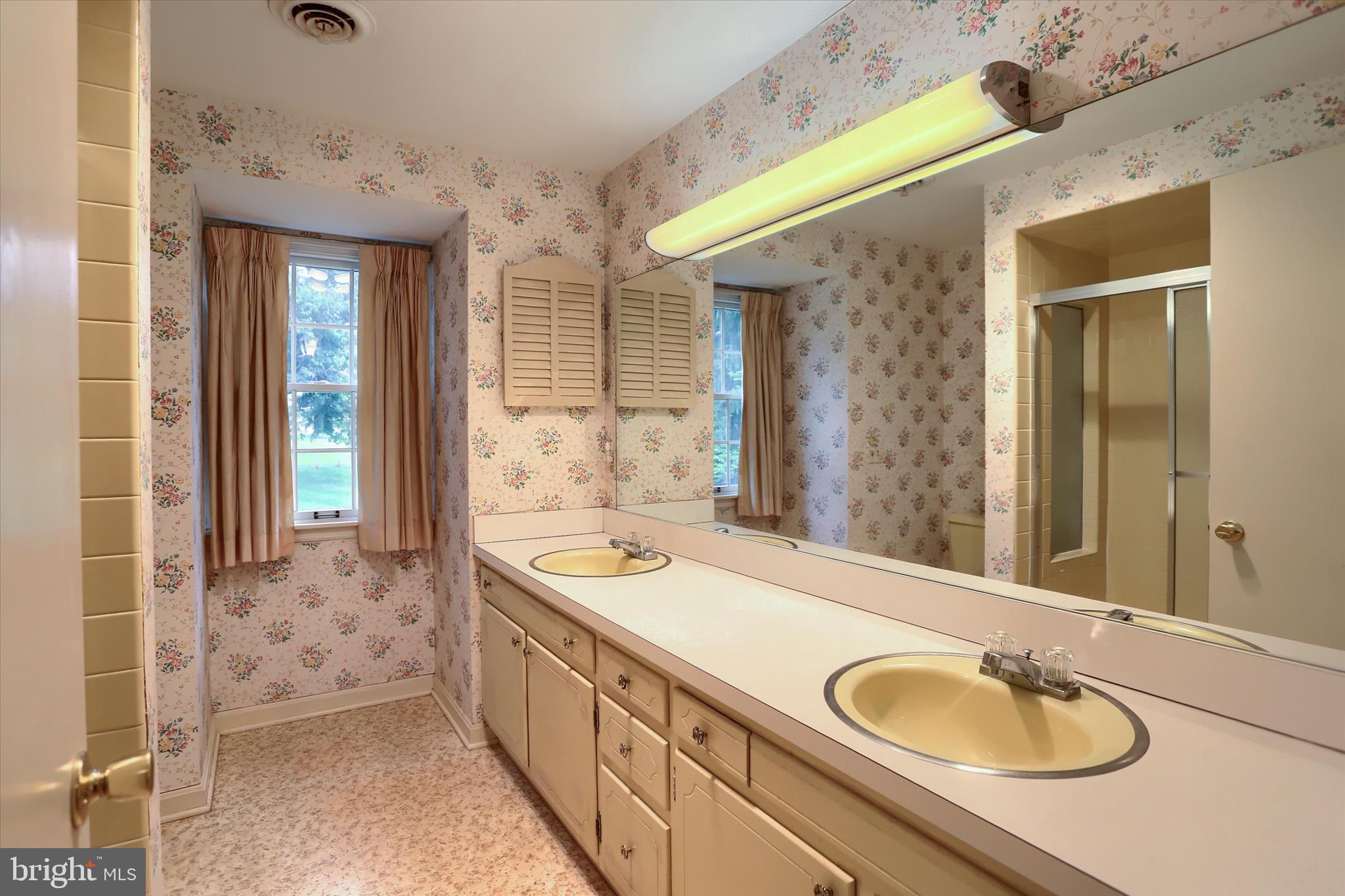 2919 Arcona Road Mechanicsburg, PA 17055 - Photo 26 of 49 a spacious bathroom with a sink double vanity and a mirror