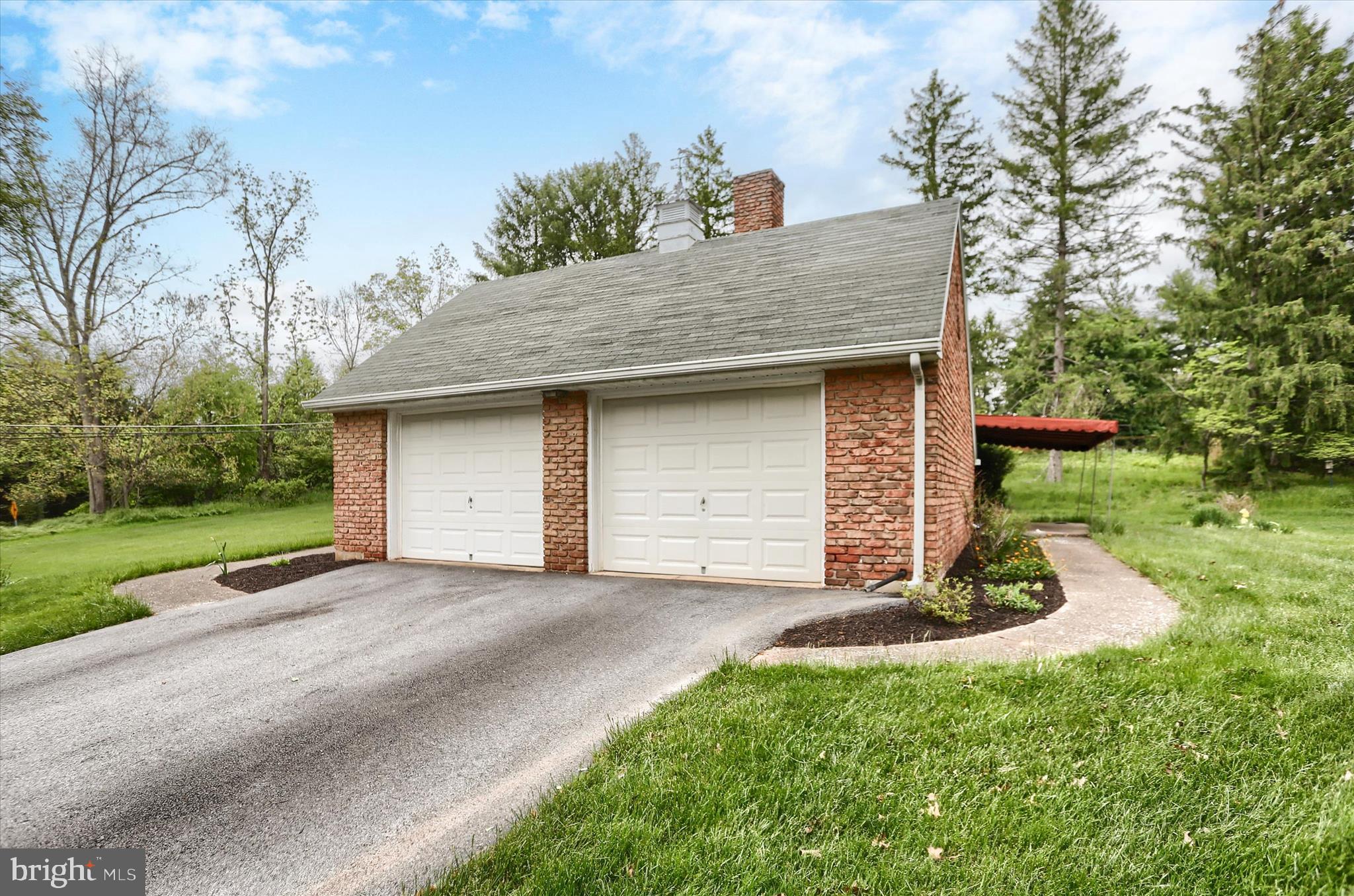 2919 Arcona Road Mechanicsburg, PA 17055 - Photo 32 of 49 a view of a house with a yard and garage