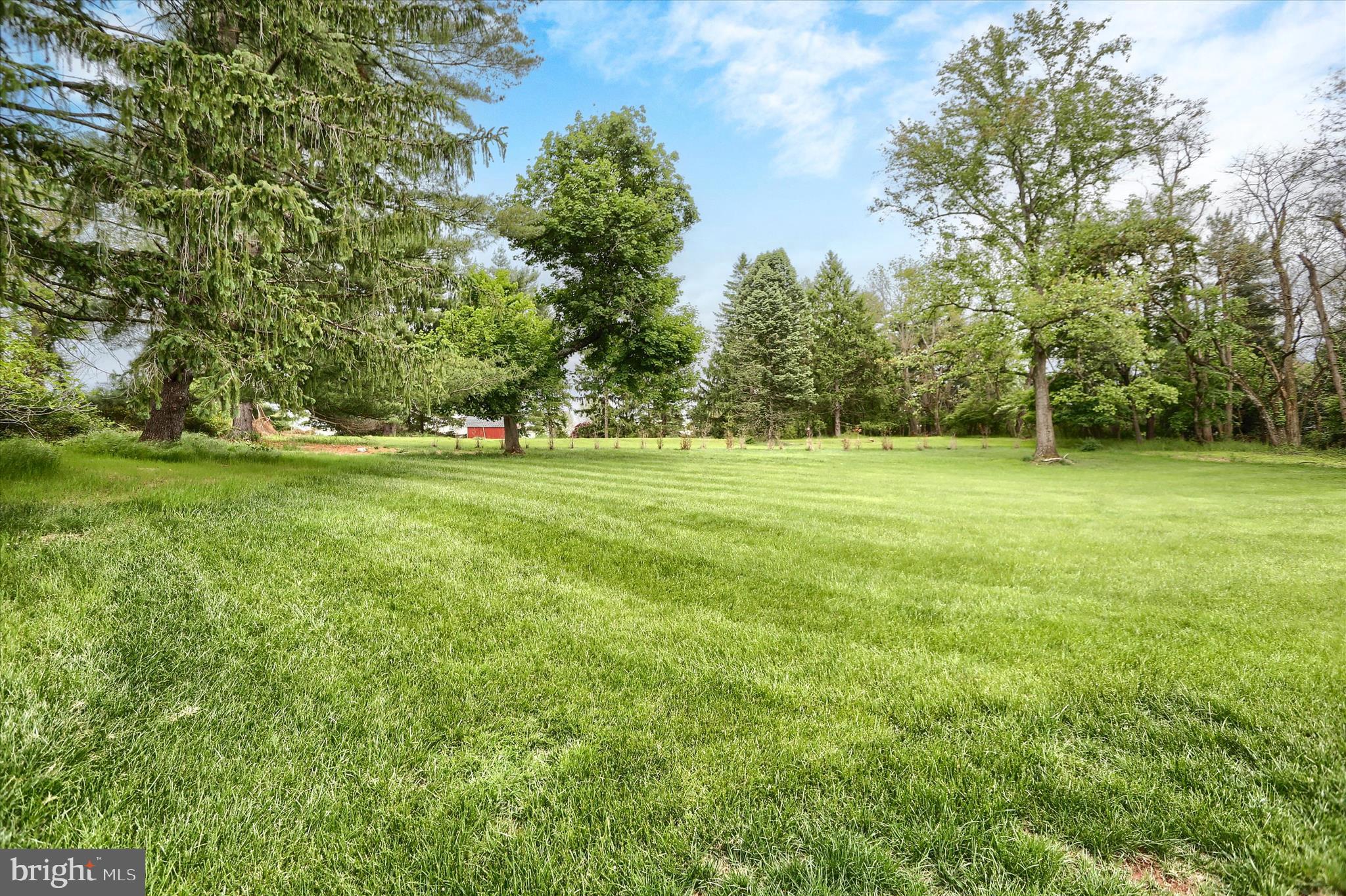 2919 Arcona Road Mechanicsburg, PA 17055 - Photo 35 of 49 a view of a grassy field with trees in the background