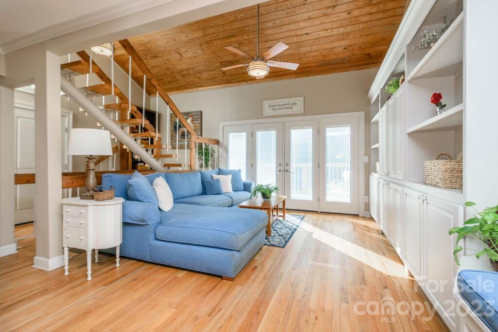 154 Rugby Drive Hendersonville, NC 28791 - Photo 20 of 48 a living room with furniture and a wooden floor