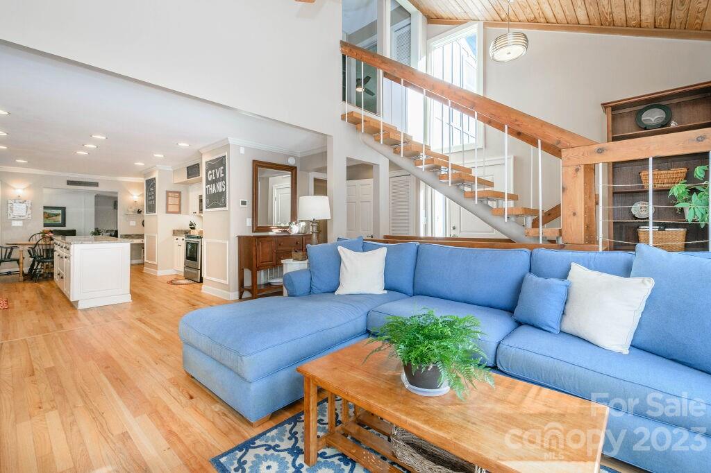 154 Rugby Drive Hendersonville, NC 28791 - Photo 22 of 48 a living room with furniture and wooden floor
