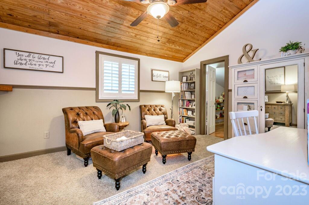 154 Rugby Drive Hendersonville, NC 28791 - Photo 32 of 48 a living room with furniture and wooden floor