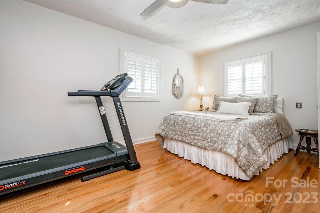 154 Rugby Drive Hendersonville, NC 28791 - Photo 37 of 48 a bedroom with a bed and a window