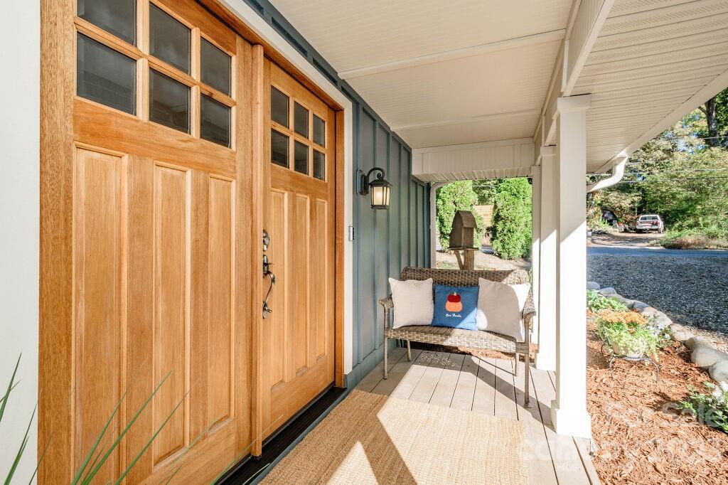 154 Rugby Drive Hendersonville, NC 28791 - Photo 4 of 48 a view of a living room and a balcony