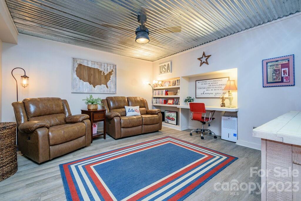 154 Rugby Drive Hendersonville, NC 28791 - Photo 41 of 48 a living room with furniture and a rug