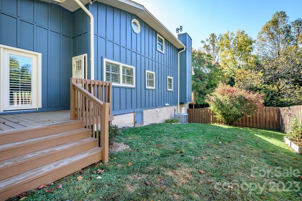 154 Rugby Drive Hendersonville, NC 28791 - Photo 44 of 48 a view of a house with backyard and porch